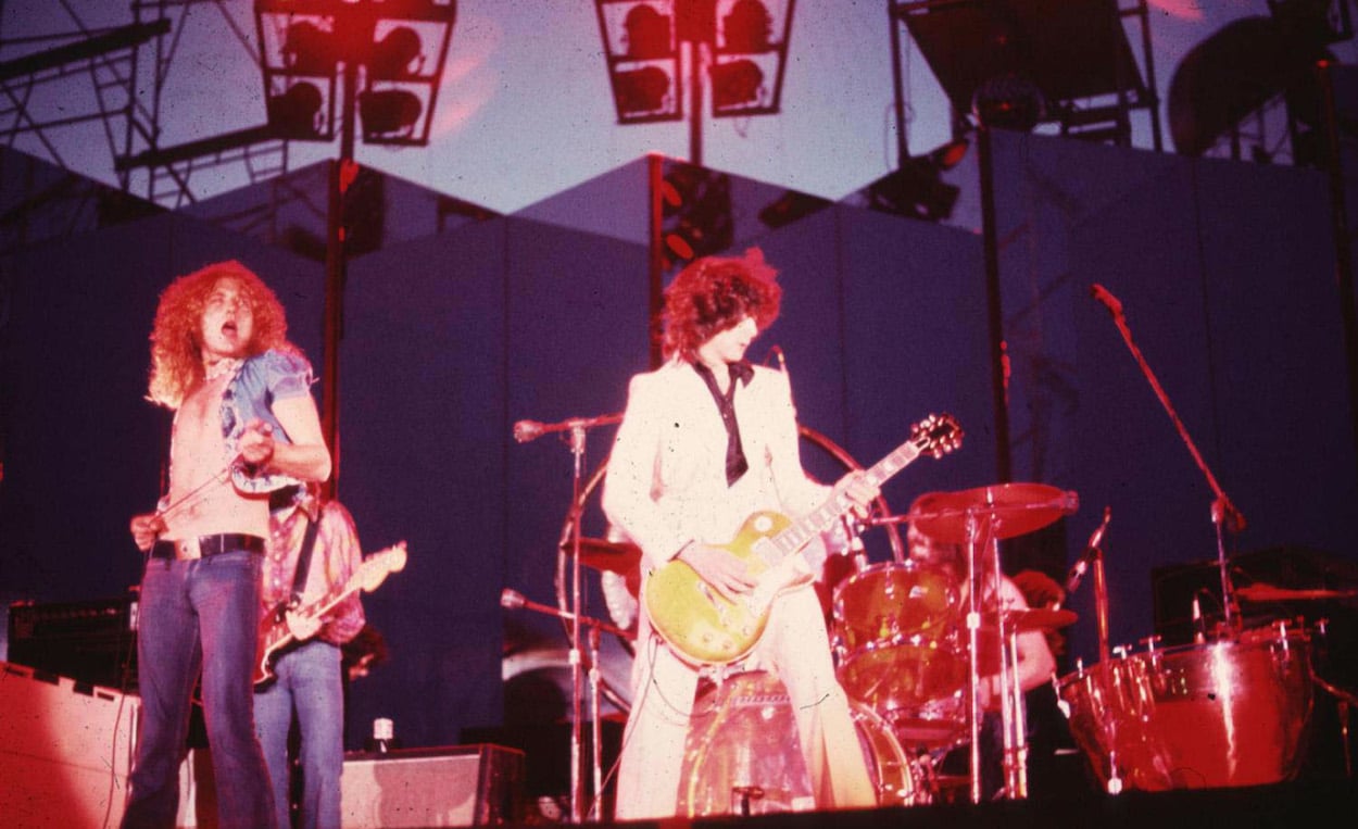 Robert Plant (left) and Jimmy Page perform with Led Zeppelin in 1973, two years before they had a member of The Rolling Stones crash their concert to play an encore.