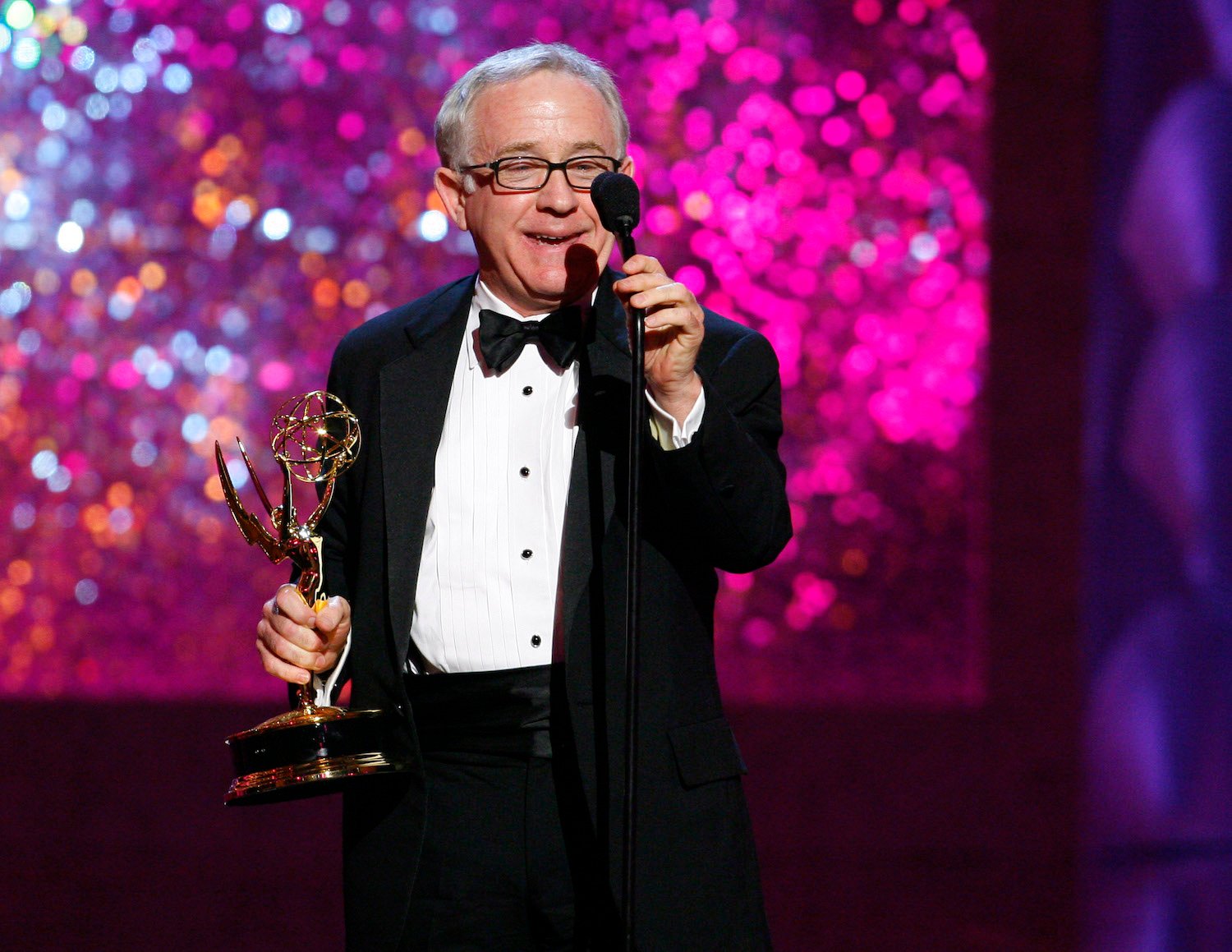 Leslie Jordan wearing a tuxedo and holding an award at the 58th Annual Creative Arts Emmy Awards