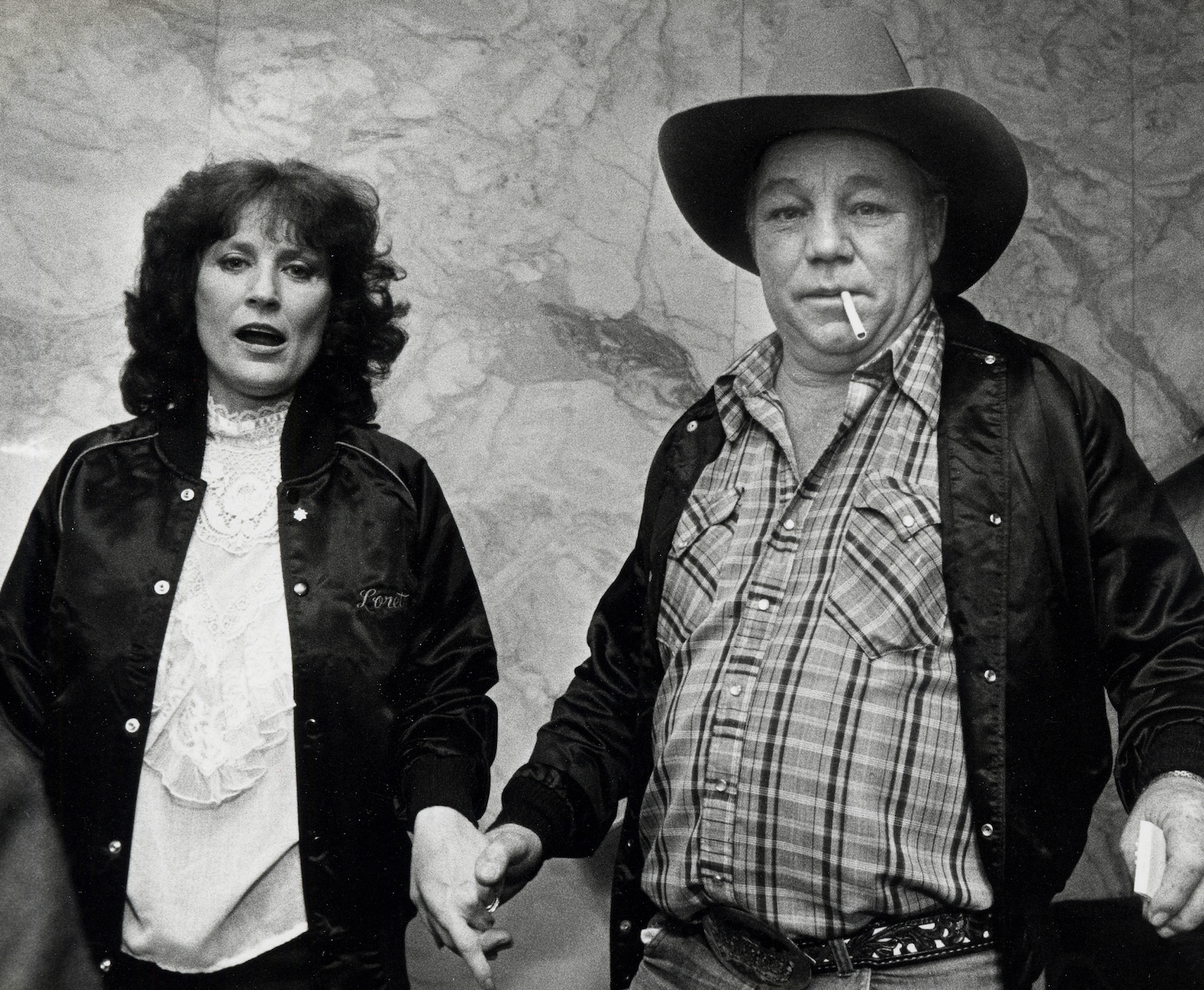 A black and white photo of Loretta Lynn and Oliver Lynn
