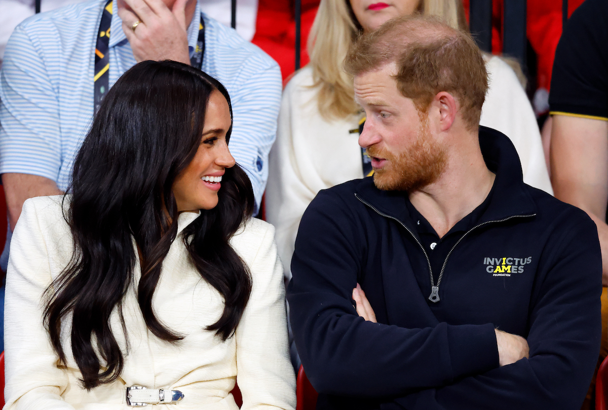 Meghan Markle, who finishes Prince Harry's sentences which is a sign they're 'excellent communicators' in their marriage according to a body language expert, talks to Prince Harry