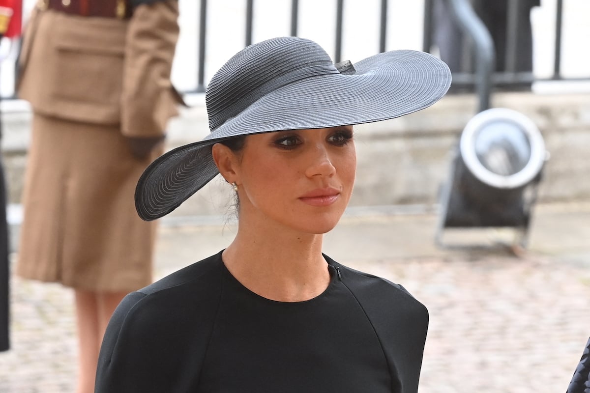 Meghan Markle, who made no mention of Queen Elizabeth's death when her 'Archetypes' podcast returned to Spotify on Oct. 4, 2022, arrives at Westminster Abbey for Queen Elizabeth's funeral