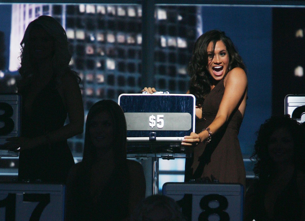 Meghan Markle, who said on the Oct. 18 episode of 'Archetypes' se'll 'never forget' being told to 'suck it in' backstage on 'Deal or No Deal' opens a briefcase on 'Deal or No Deal'