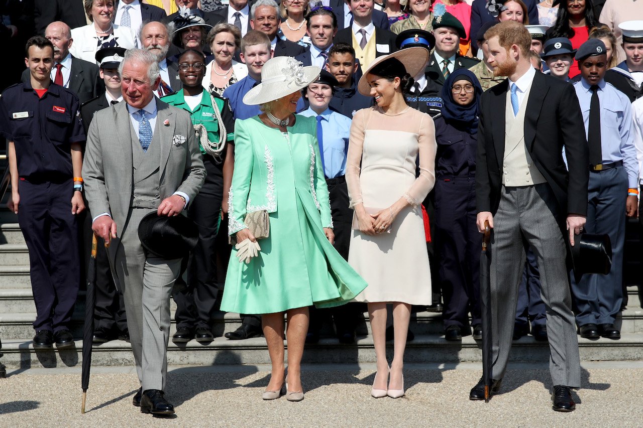 (L-R) King Charles III, Queen Consort Camilla, Meghan Markle, and Prince Harry pose for a photograph as they attend The Prince of Wales' 70th Birthday Patronage Celebration in 2018.