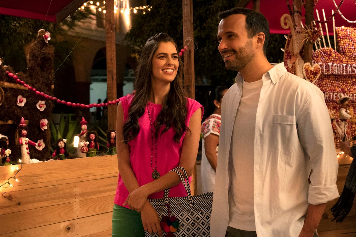 Woman in a pink top smiling at a man in 'Merry Textmas''