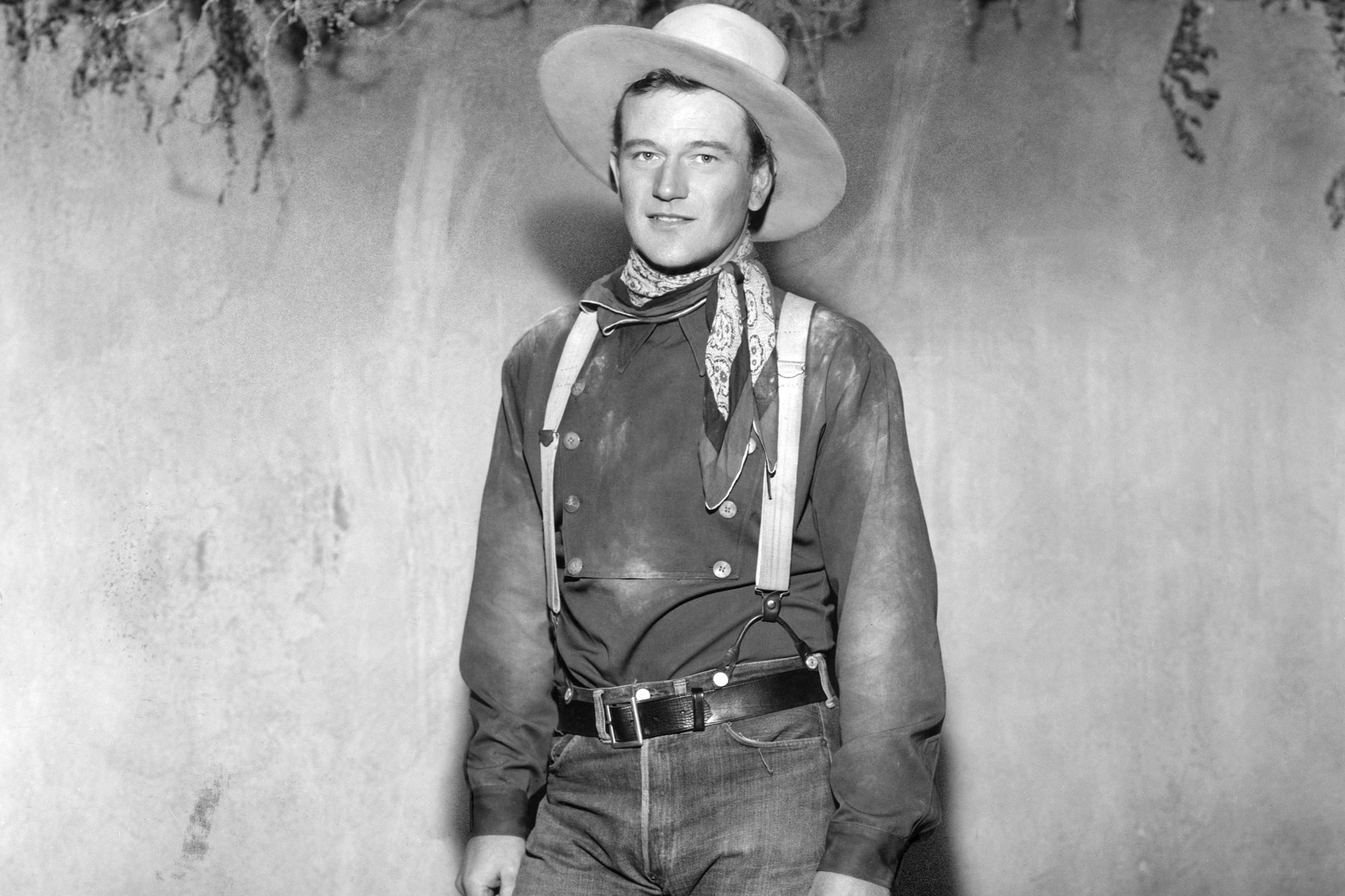 Movie star John Wayne wearing a Western cowboy outfit from 'Stagecoach'