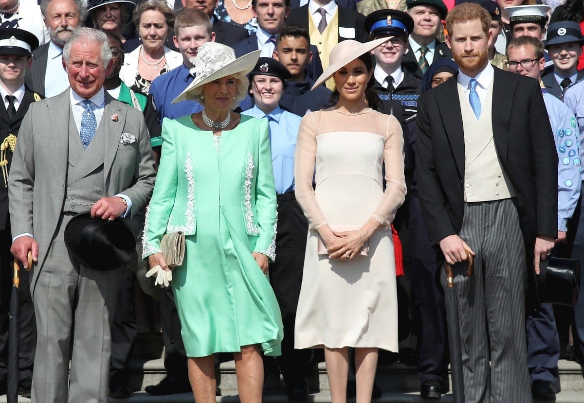 Now-King Charles III, Camilla Parker Bowles, Meghan Markle, and Prince Harry, who may now be rivals, pose for a photo as they attend Charles' 70th Birthday Patronage Celebration