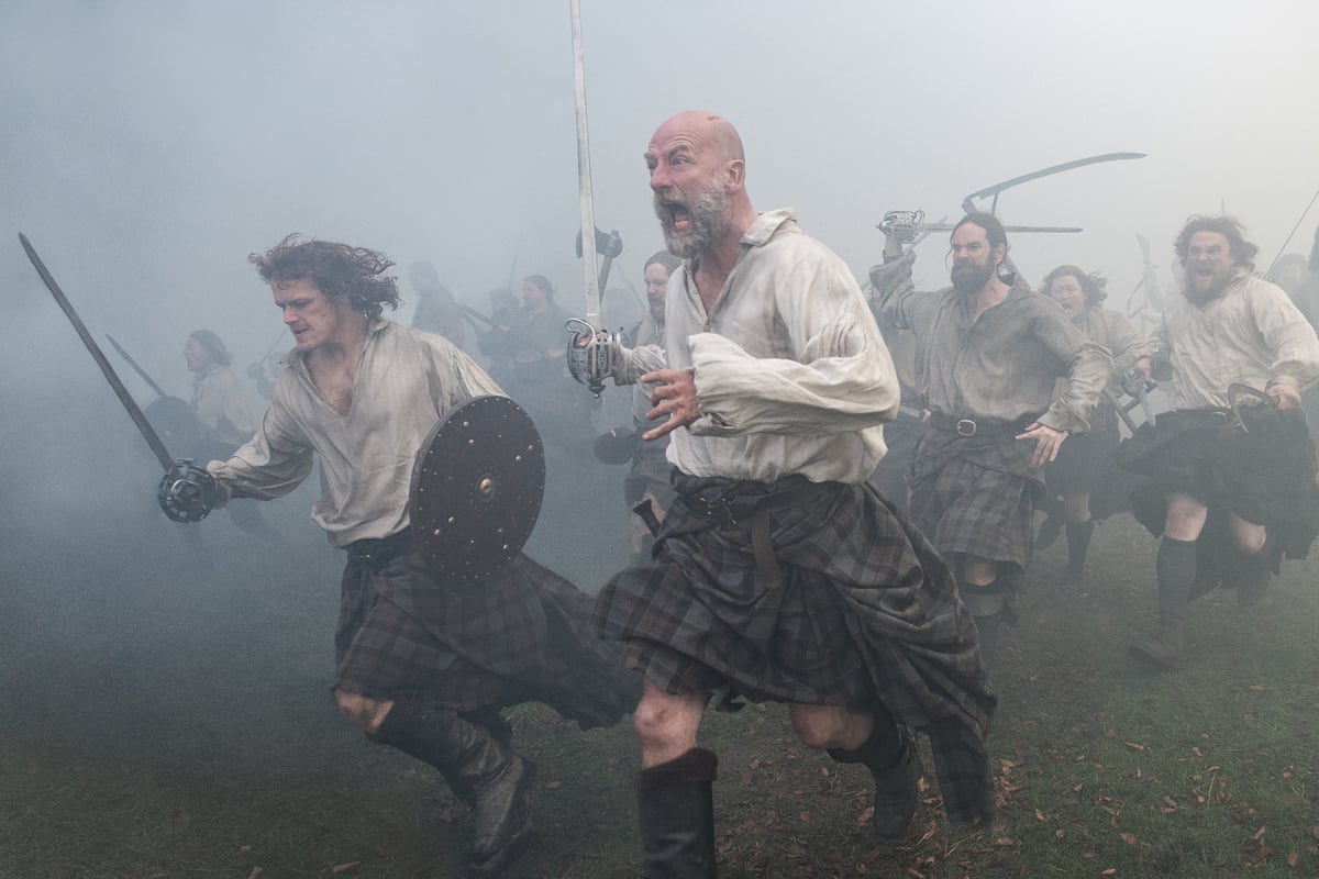 Outlander stars Sam Heughan as Jamie Fraser and Graham McTavish as Dougal MacKenzie in an image from season 2