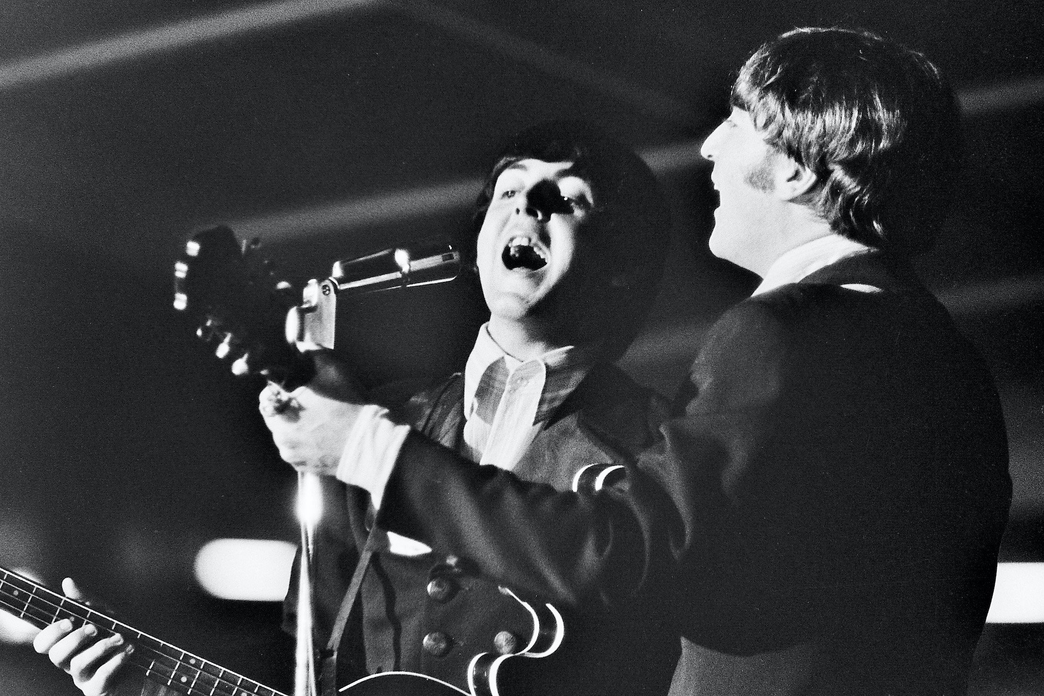 Paul McCartney and John Lennon of The Beatles perform in St. Louis, Missouri
