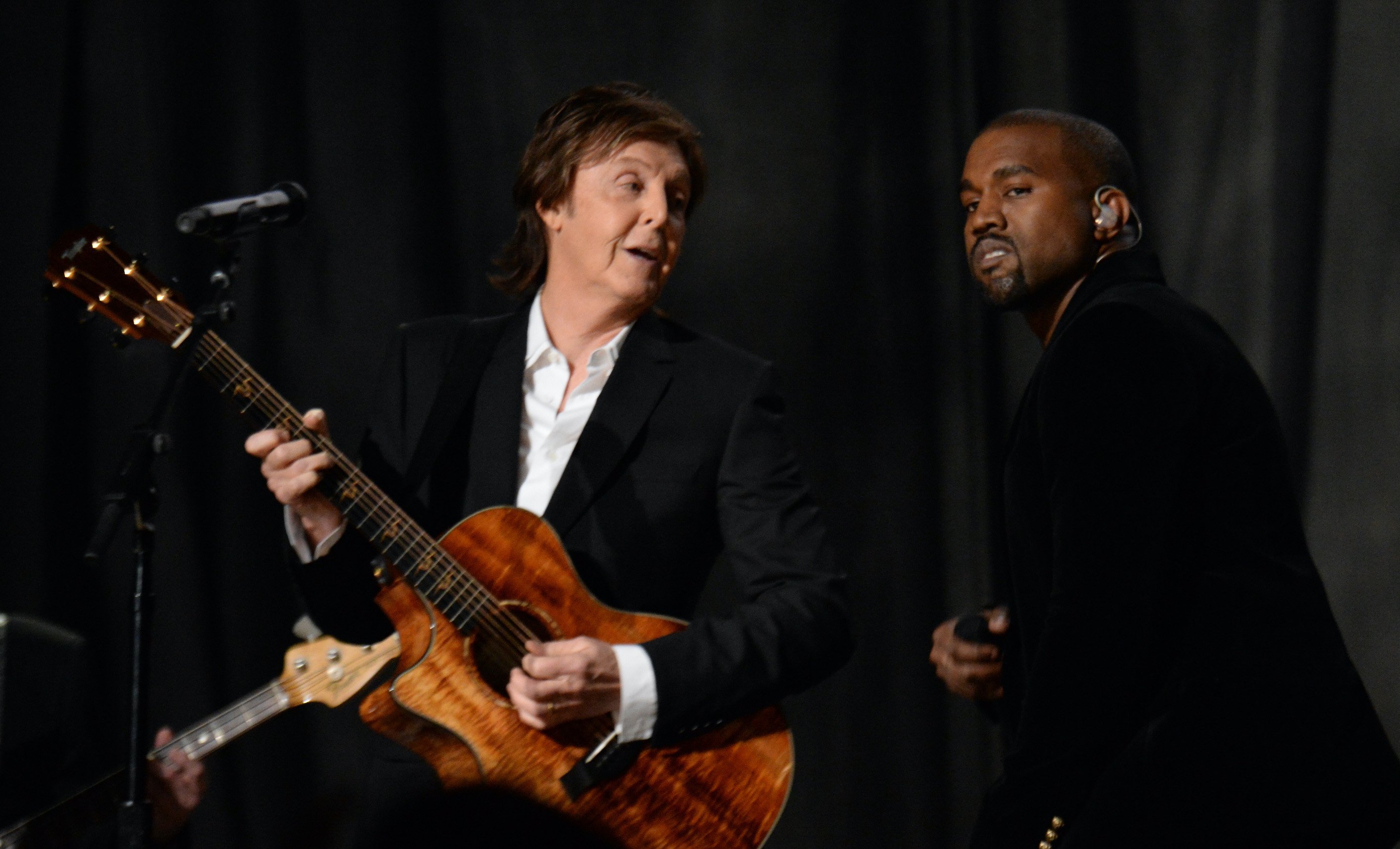Paul McCartney and Kanye West performing onstage at the 57th annual Grammy Awards