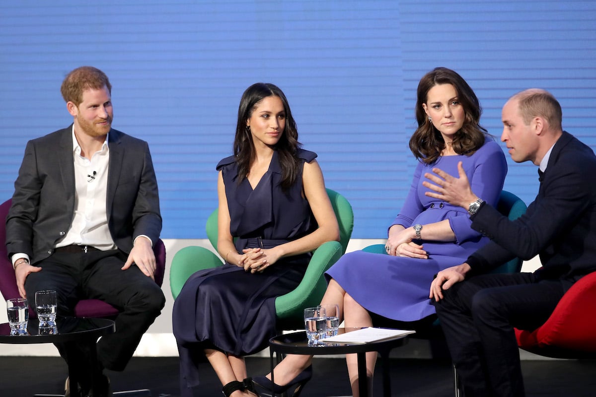 Prince William and Kate Middleton, who had a 'wake-up moment' at Meghan Markle's first royal engagement, the Royal Foundation Forum panel in 2018, sit next to Meghan Markle and Prince Harry