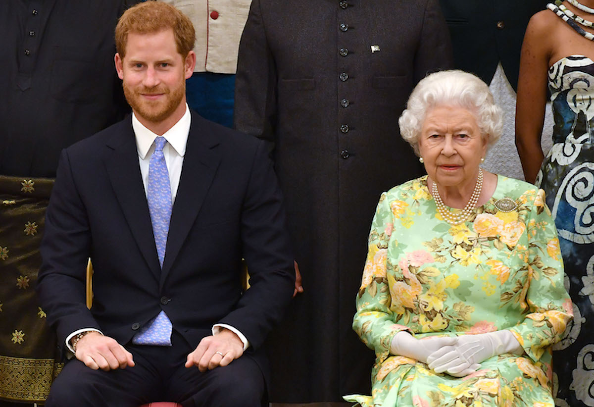 Prince Harry and Queen Elizabeth, who according to Valentine Low's 'Courtiers' book said she had 'great fun' filming the 2016 Invictus Games video with Prince Harry, sit next to each other