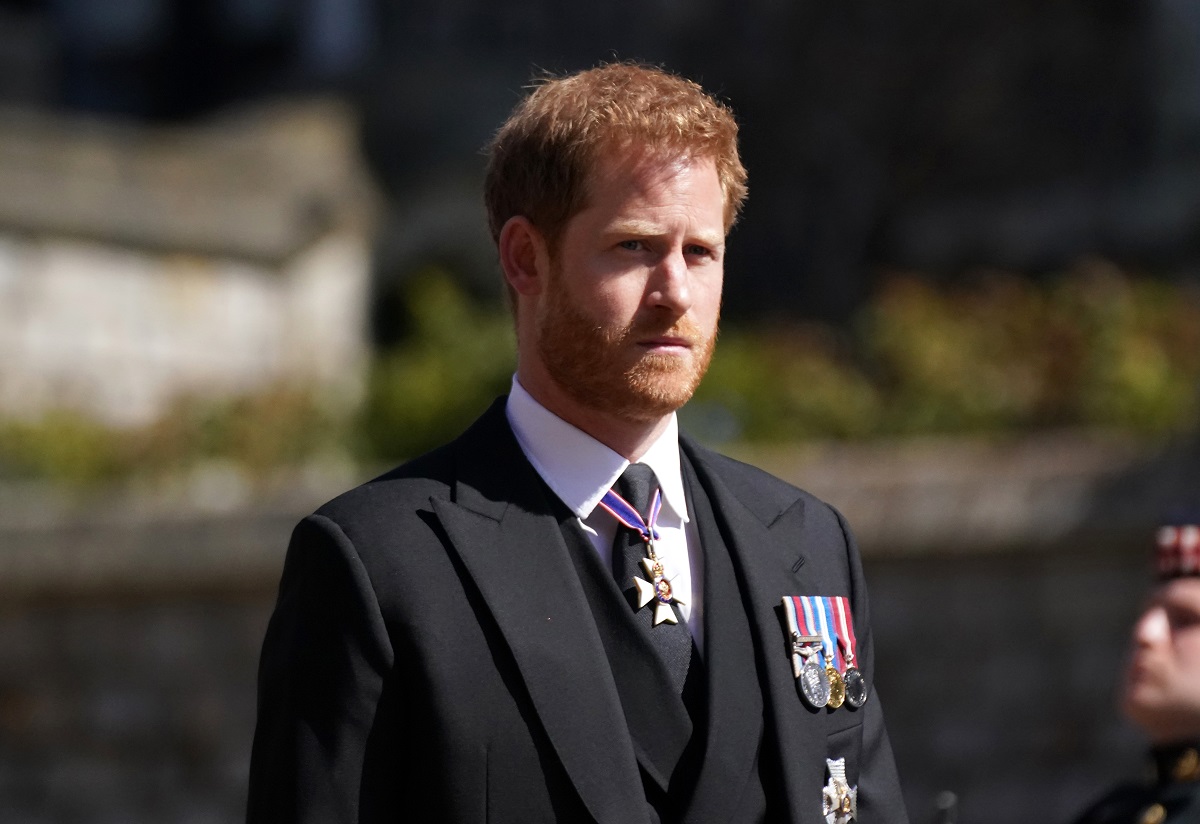 Prince Harry standing outside St. George's Chapel for Prince Philip's funeral