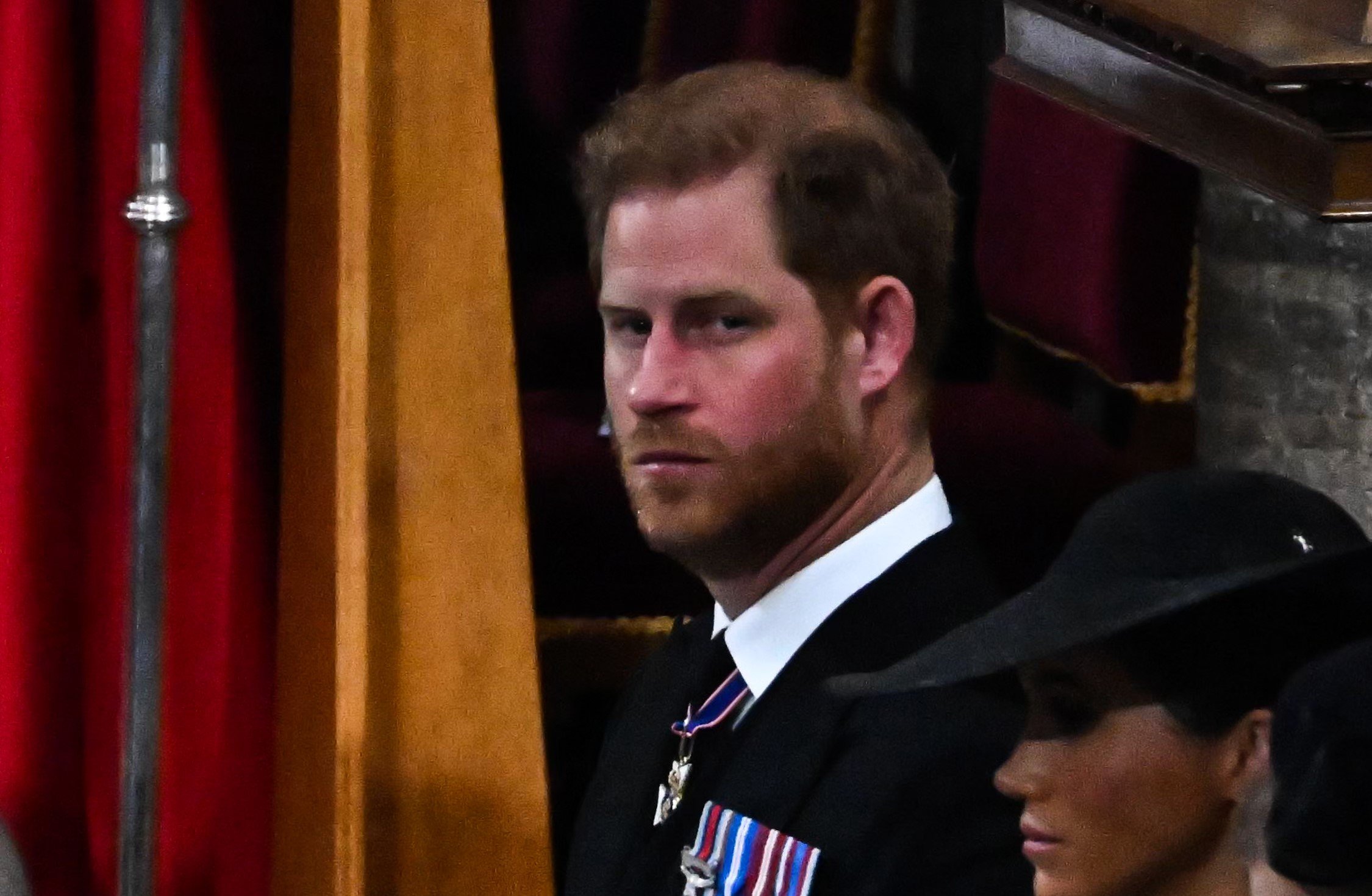 Prince Harry, who an expert says showed a lot of anger during Queen Elizabeth II's funeral, pictured during the service