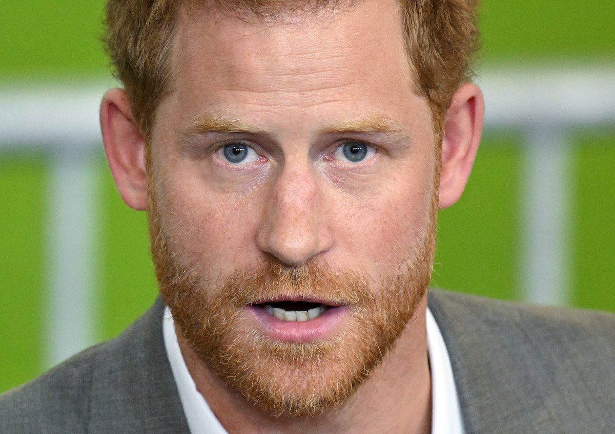 Prince Harry, whose original text of his memoir will 'always be a threat' for leaking according to a royal expert, looks on