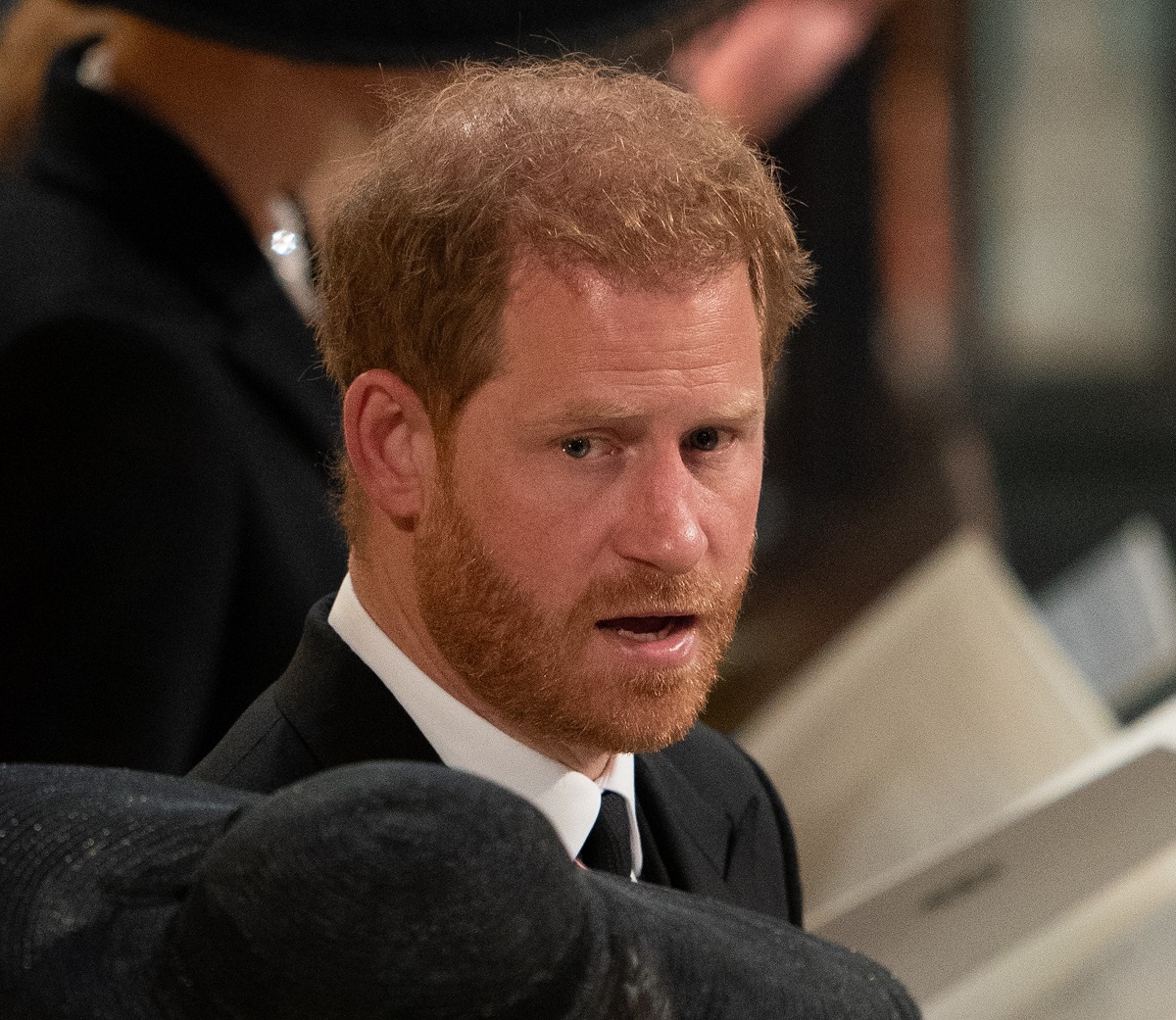 Prince Harry seated during Queen Elizabeth II's committal service at St George's Chapel in Windsor Castle
