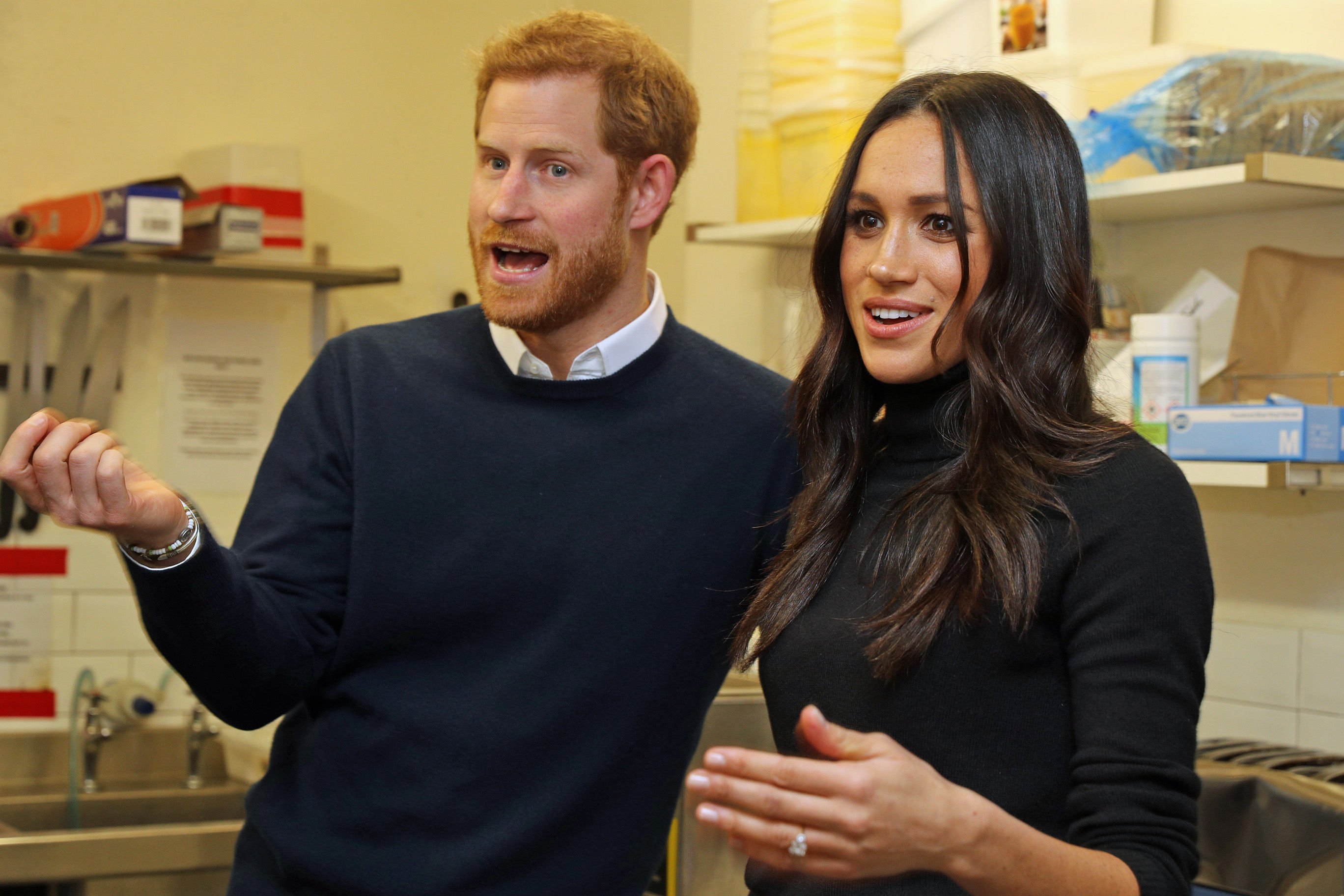 Prince Harry and Meghan Markle stand next to each other during a visit to Social Bite in Scotland.