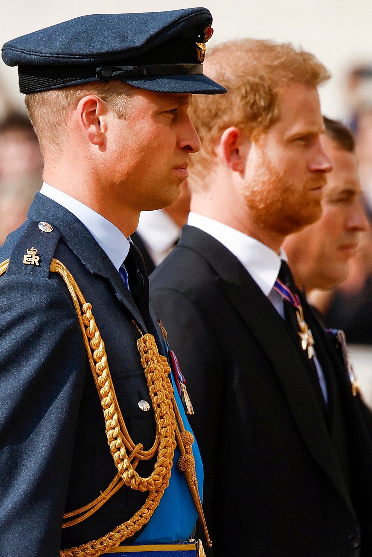 Prince William and Prince Harry walk behind the coffin of Queen Elizabeth II during the Lying Parade in the country