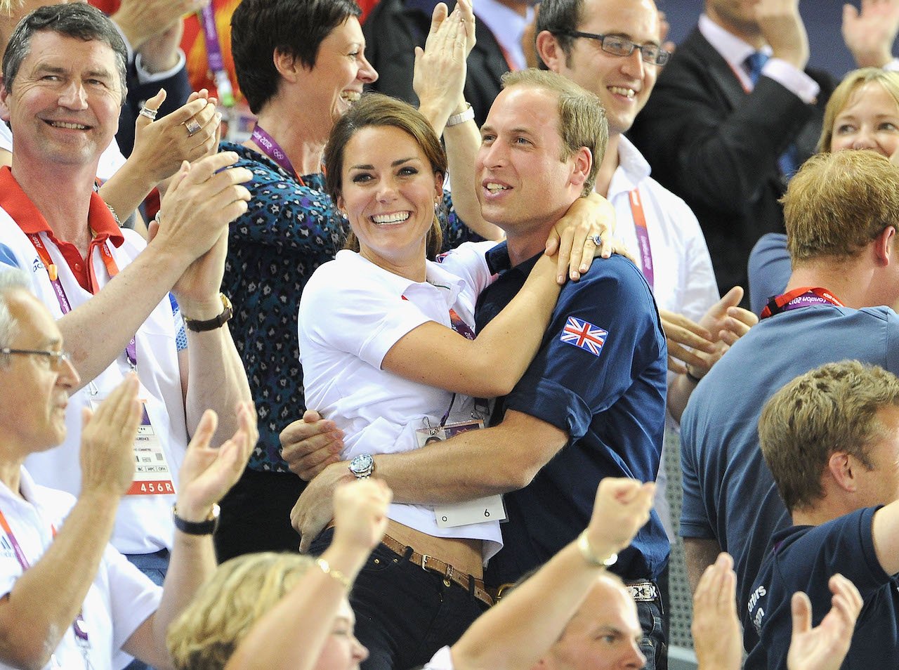Prince William and Kate Middleton embrace on Day 6 of the London 2012 Olympic Games at Velodrome on August 2, 2012, in London, England.