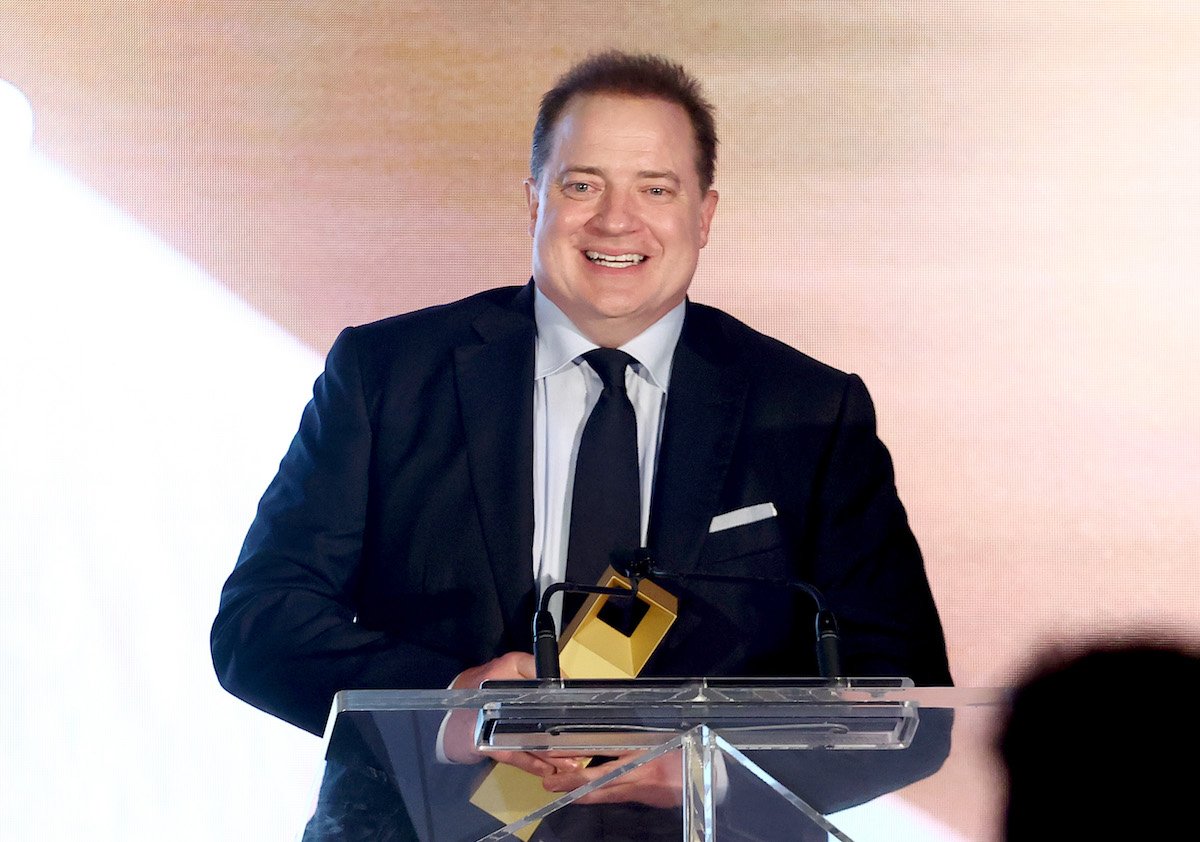 'Professionals' star Brendan Fraser holds his TIFF Tribute Award in Toronto