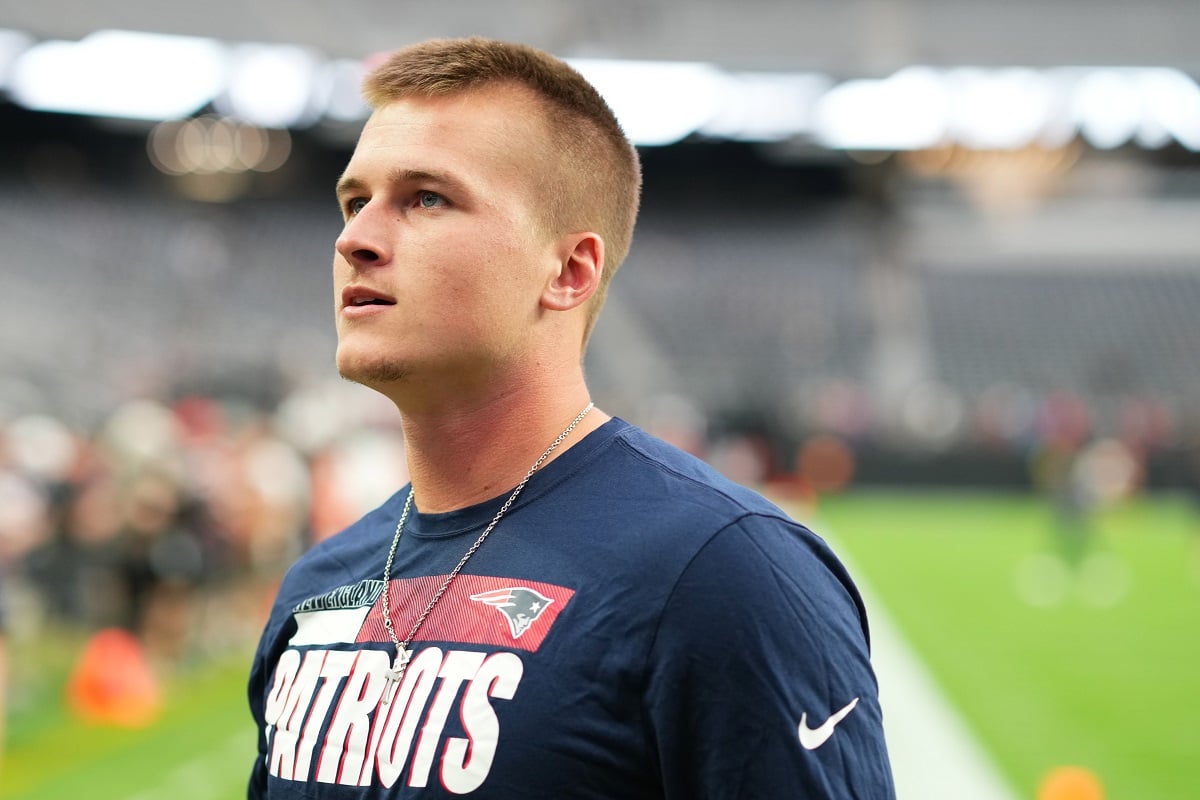 New England Patriots quarterback Bailey Zappe, who has a girlfriend named Hannah Lewis,  looks on during warmups before a preseason game against the Las Vegas Raiders
