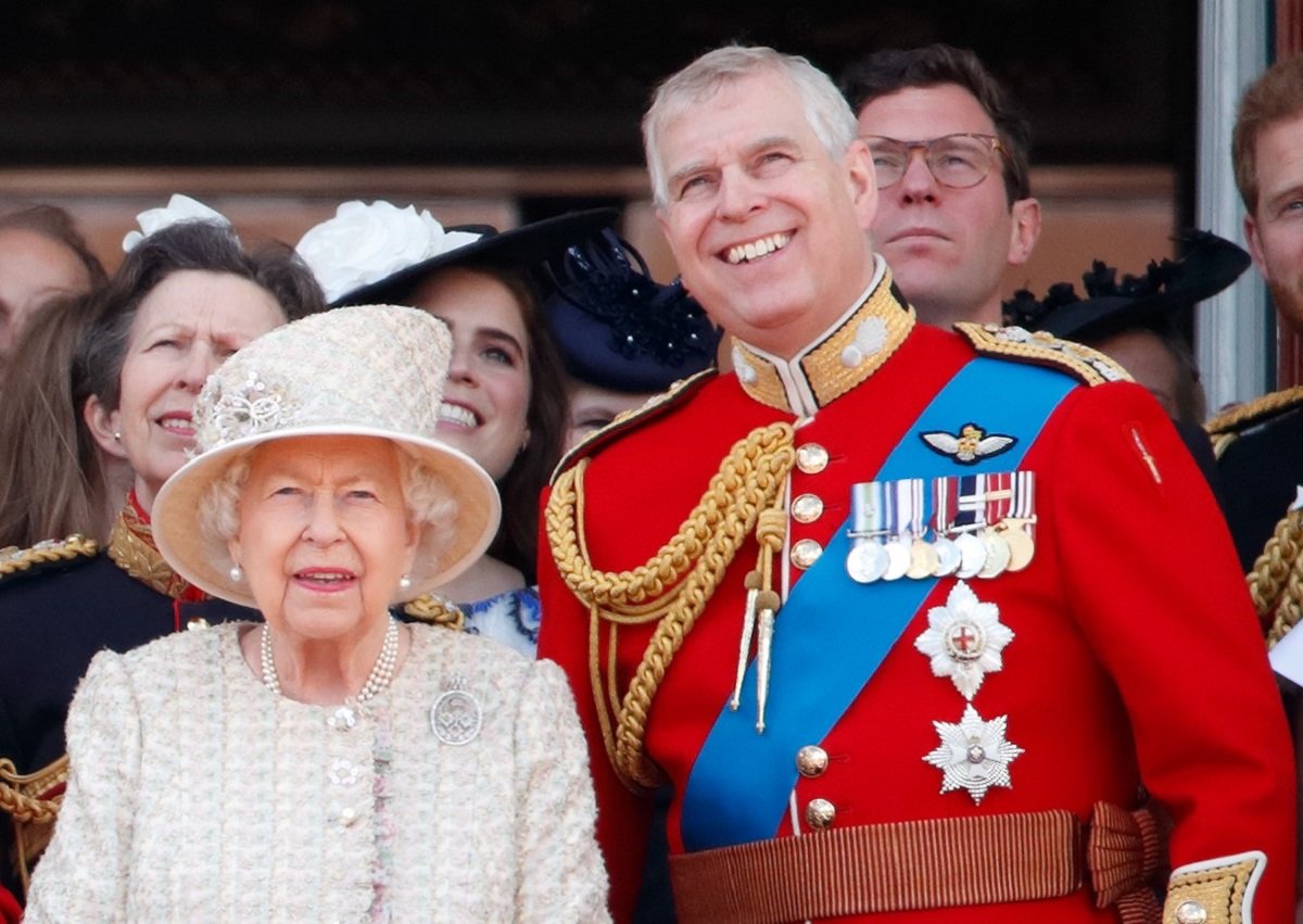 Queen Elizabeth II and Prince Andrew watch a flypast from the balcony of Buckingham Palace during Trooping The Colour