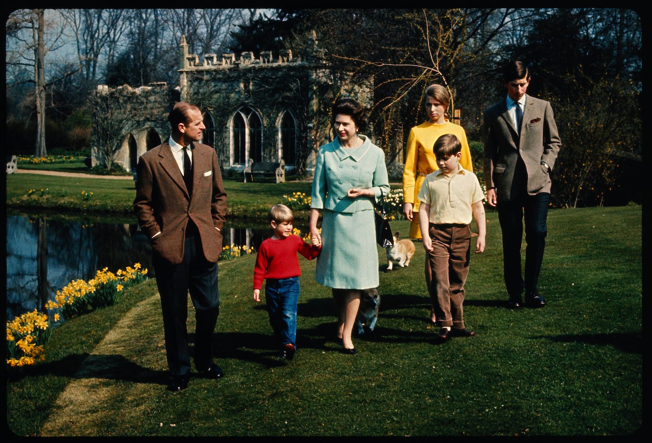 An informal group of the royal family on the grounds of Windsor Castle c. 1968. (L-R) Prince Philip, Prince Edward, Queen Elizabeth II, Prince Andrew, Princess Anne, and King Charles III.