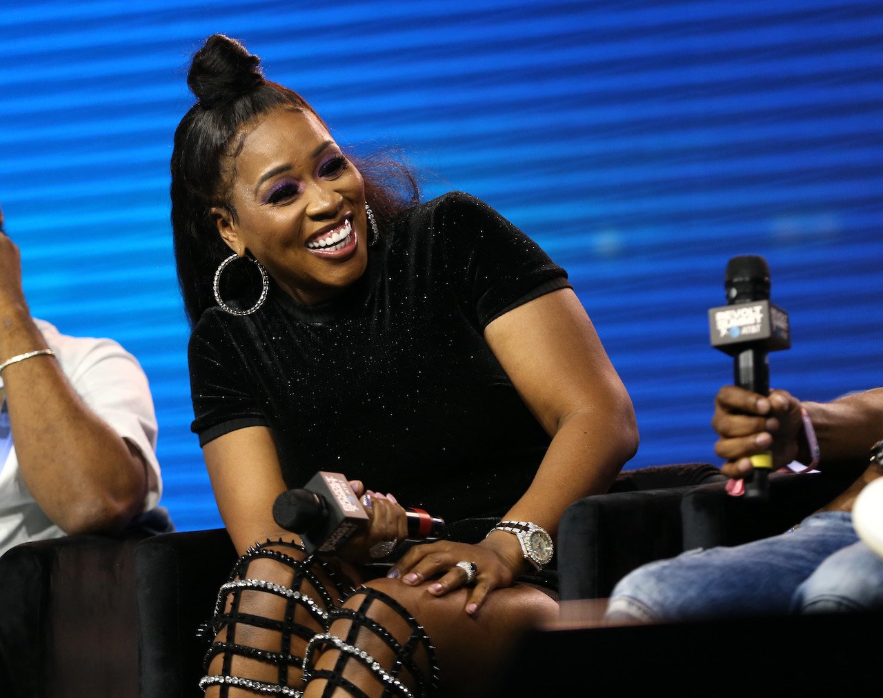 Remy Ma laughs on stage; the rapper was in the running to be cast on 'RHONY' Season 13