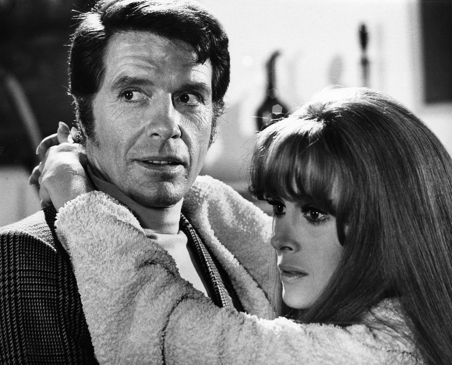 A black and white movie still of Robert Norton and Jill St. John