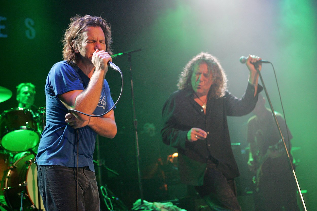 Pearl Jam singer Eddie Vedder (left) and former Led Zeppelin singer Robert Plant play a benefit concert in 2005.