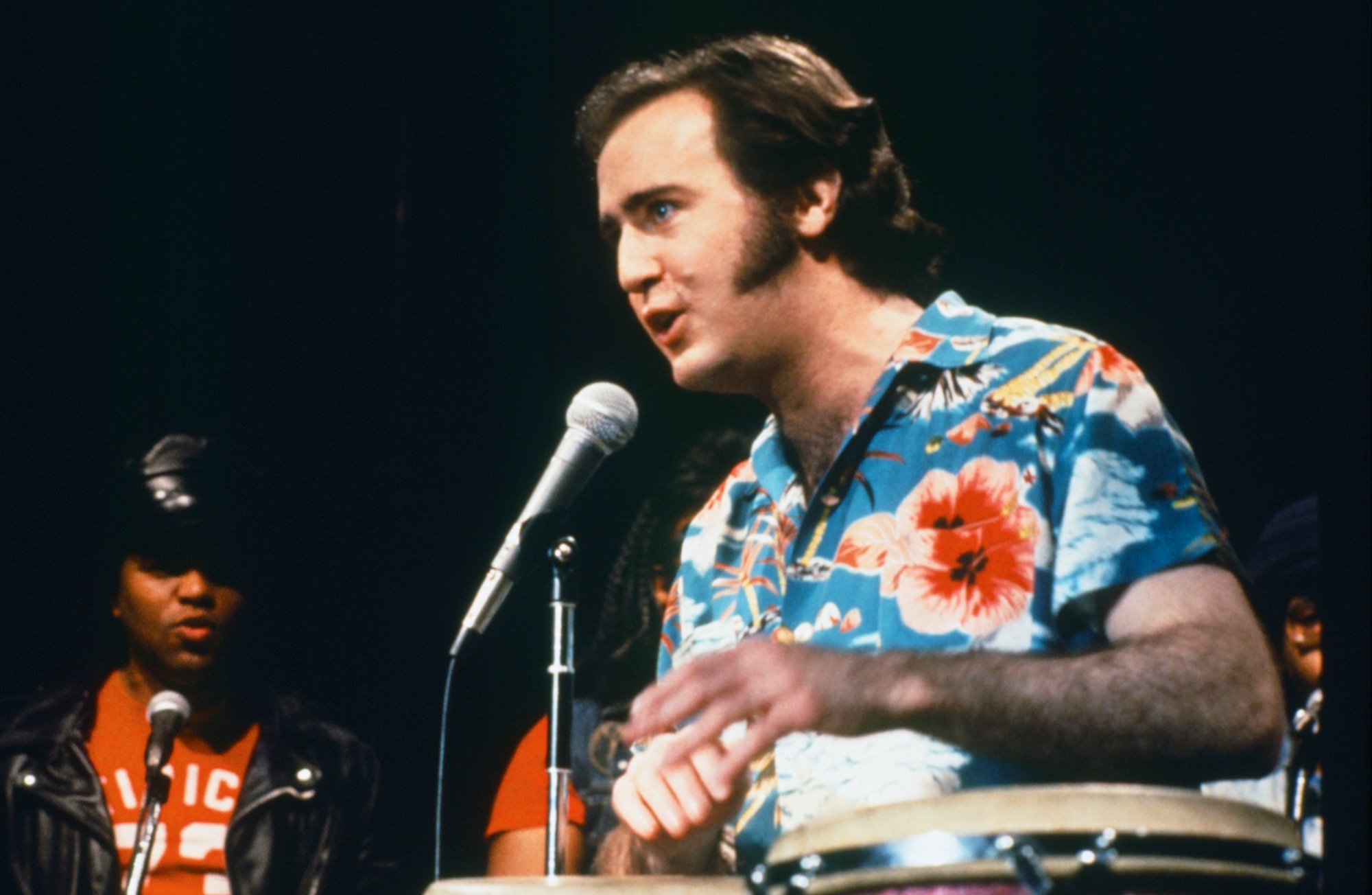 'Saturday Night Live' Andy Kaufman speaking into a microphone wearing a Hawaiian shirt