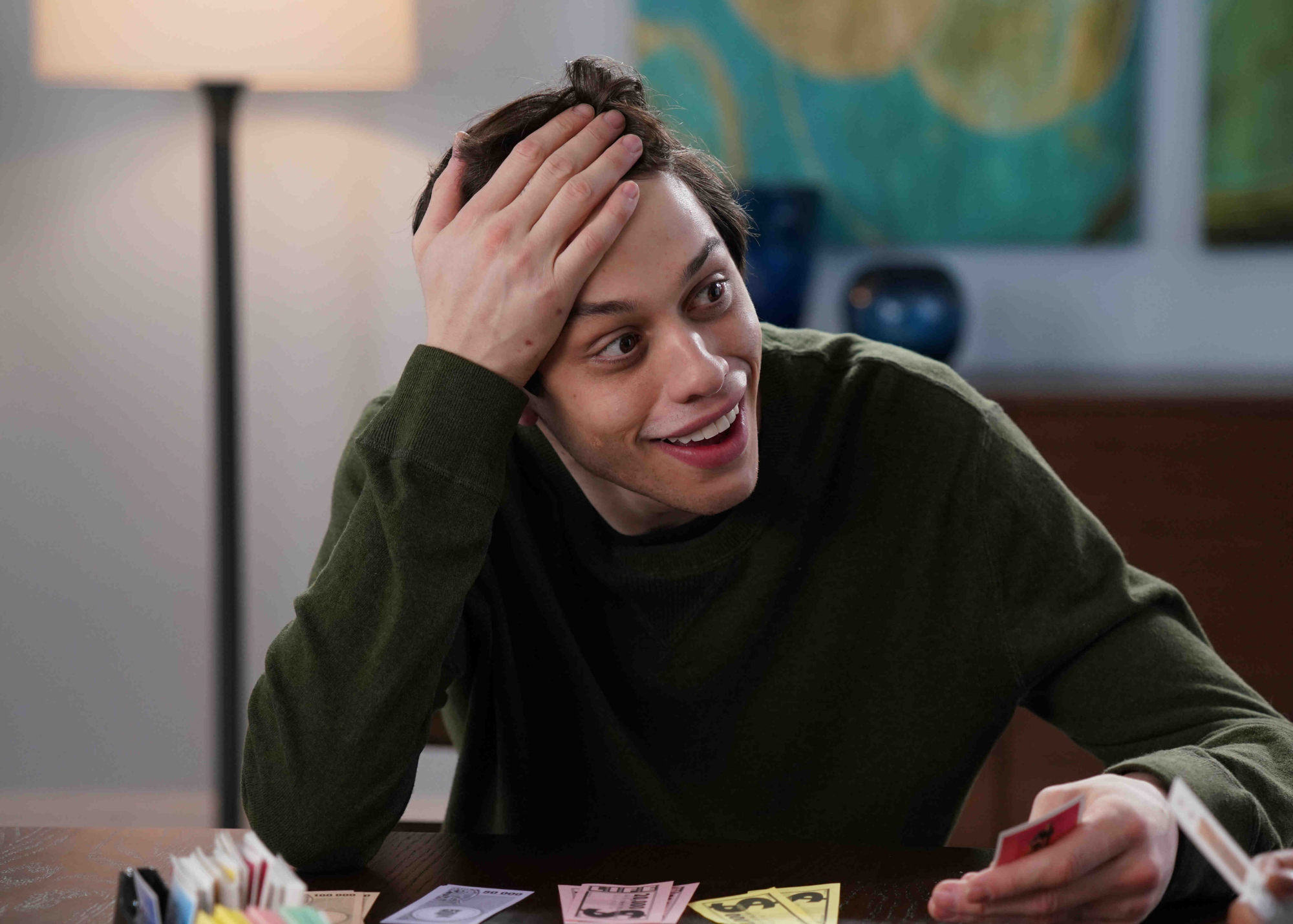 'Saturday Night Live' former cast member Pete Davidson with his hand on his forehead in disbelief.