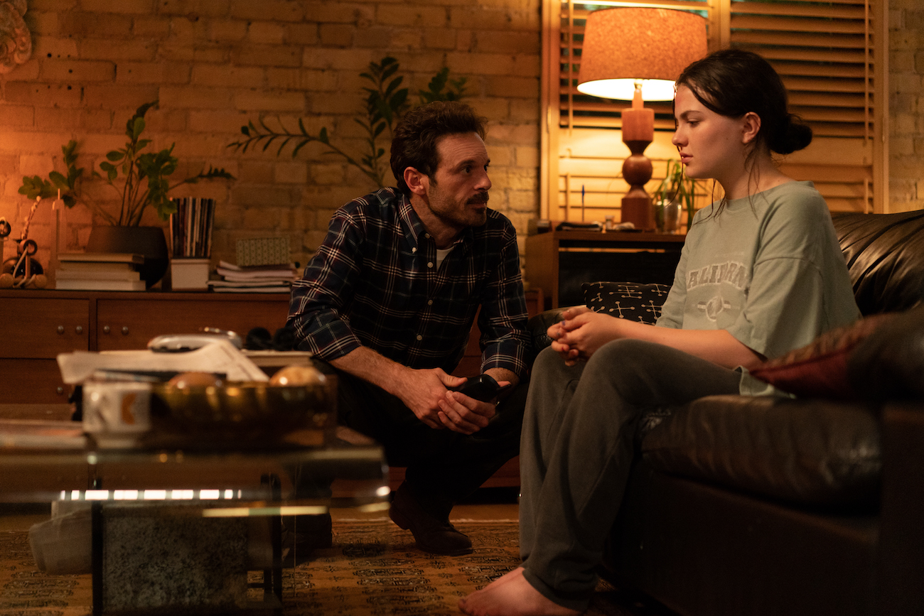 Andrew (Scoot McNairy) consoles a Young Ani (Chiara Aurelia) after her sexual assault in 'Luckiest Girl Alive'