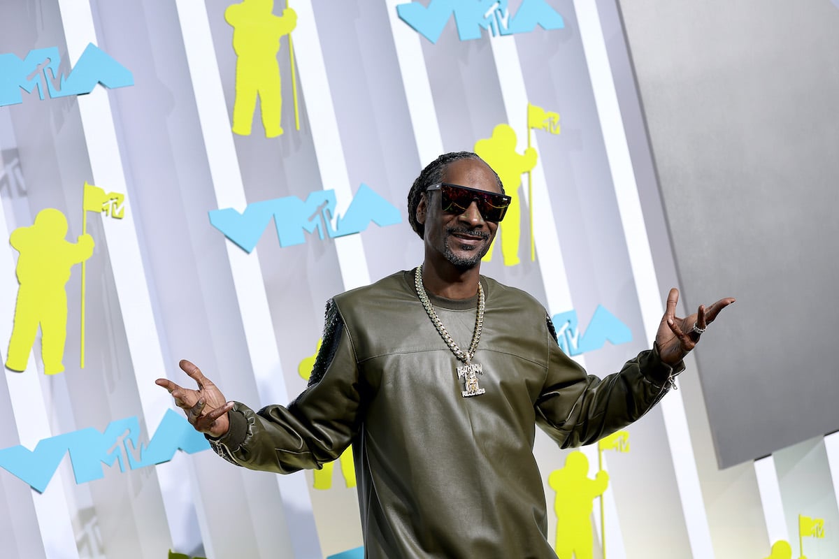 Snoop Dogg smiling, shrugging