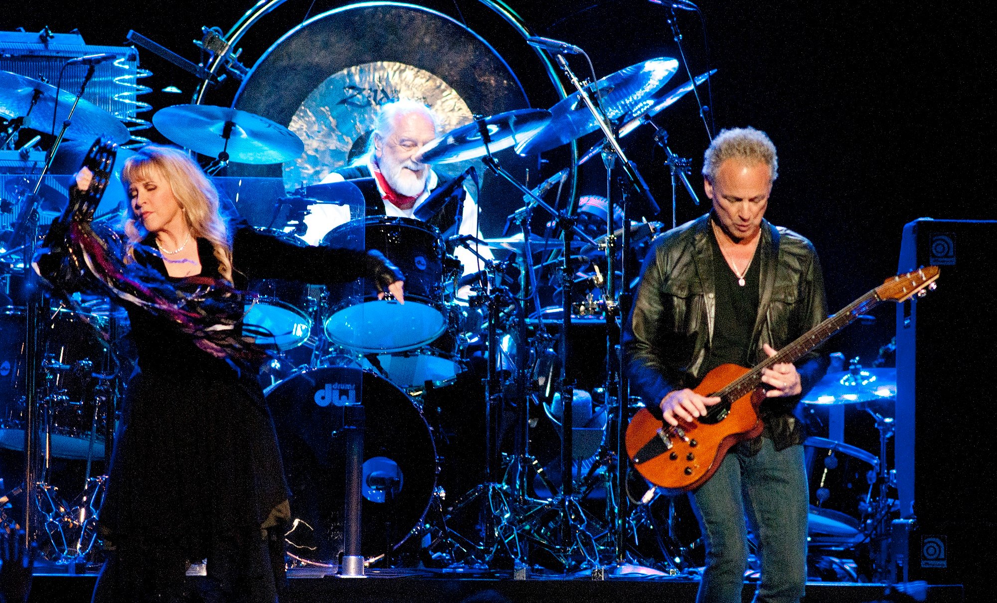 Stevie Nicks, Mick Fleetwood, and Lindsey Buckingham perform onstage as Fleetwood Mac