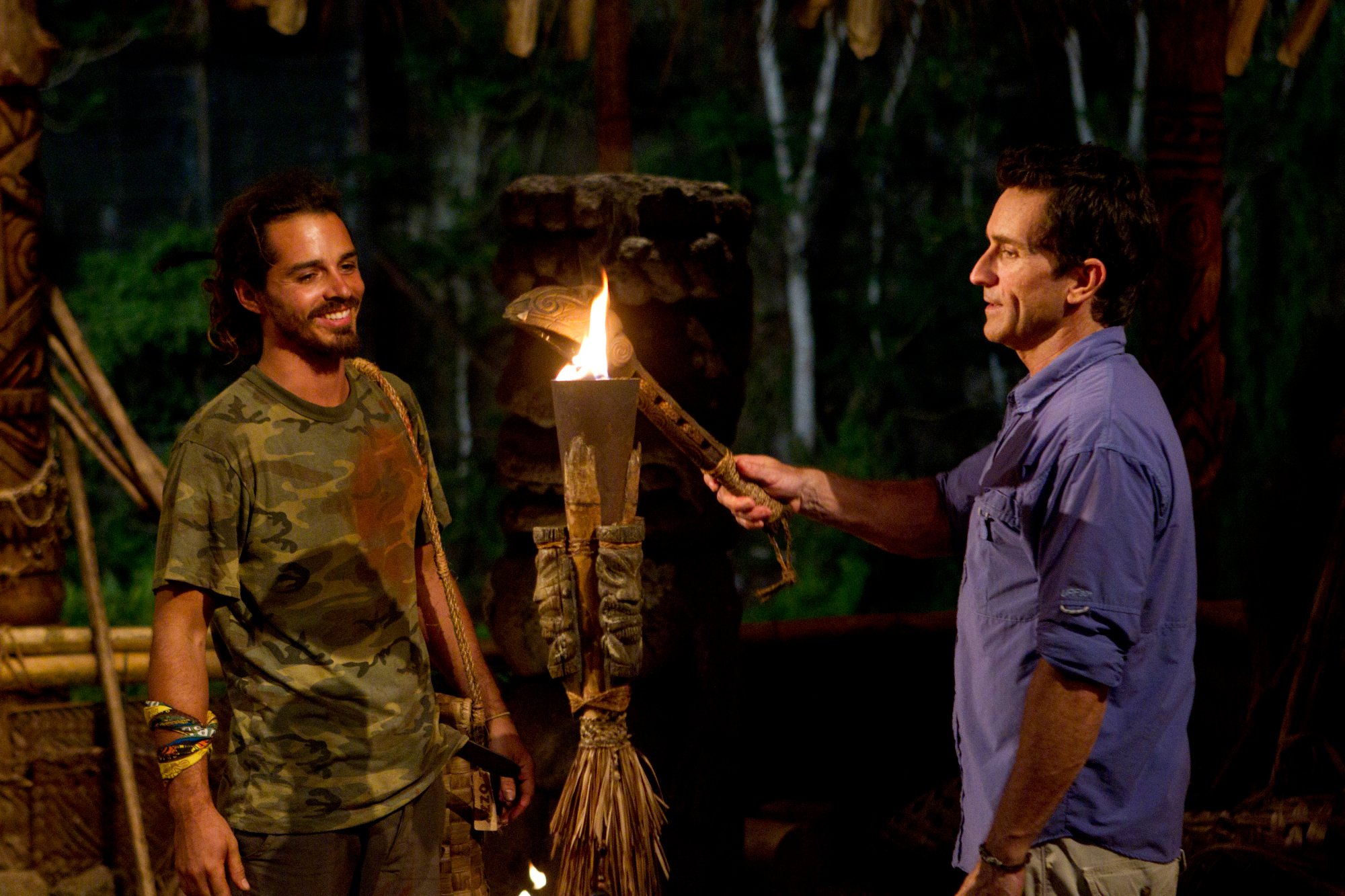 Ozzy Lusth, who one of the most popular 'Survivor' castaways in the show's history, has his torch snuffed by host Jeff Probt in 'Survivor: South Pacific.'