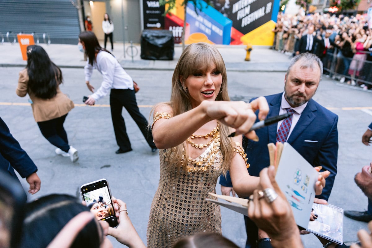 Taylor Swift signing autographs outside of TIFF