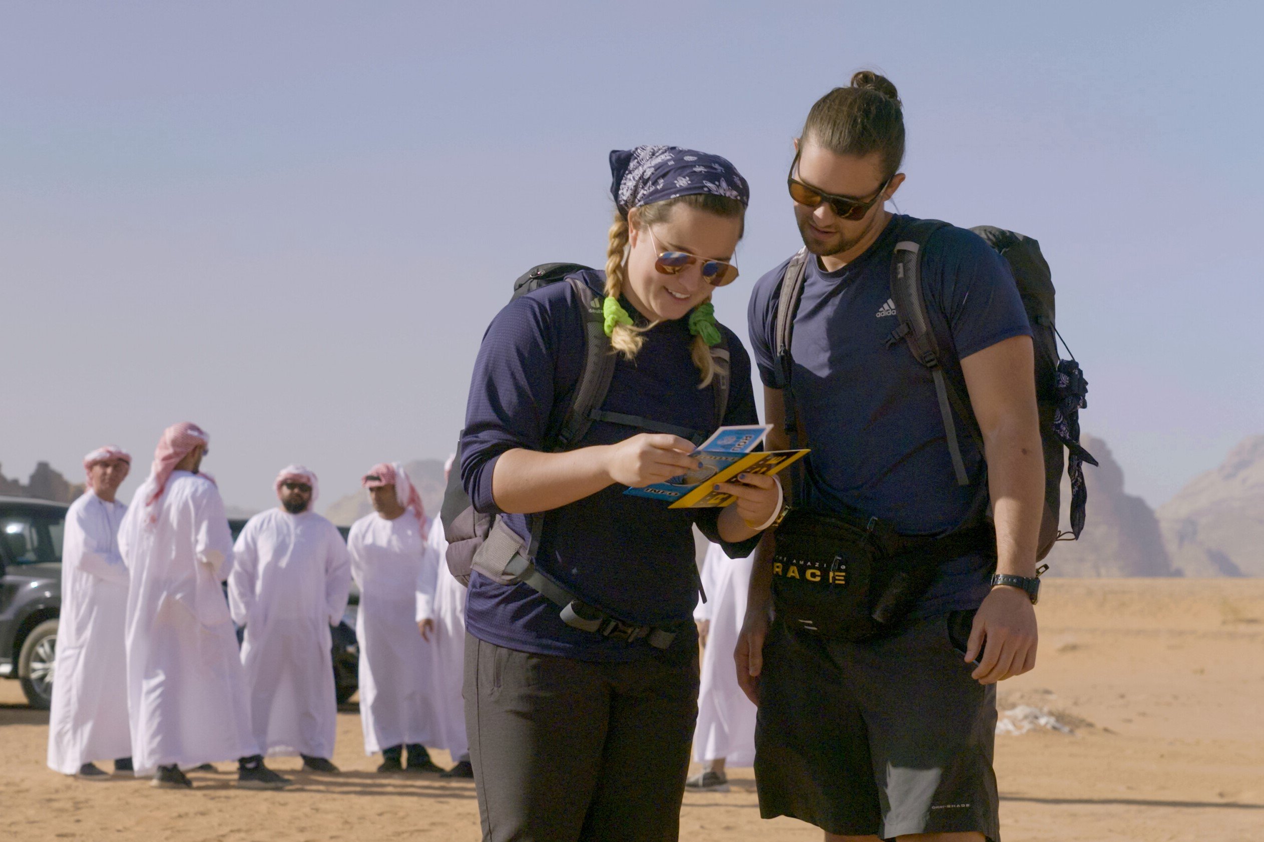 Abby Garrett and Will Freeman, who star in 'The Amazing Race' Season 34 on CBS, read a clue in Jordan.