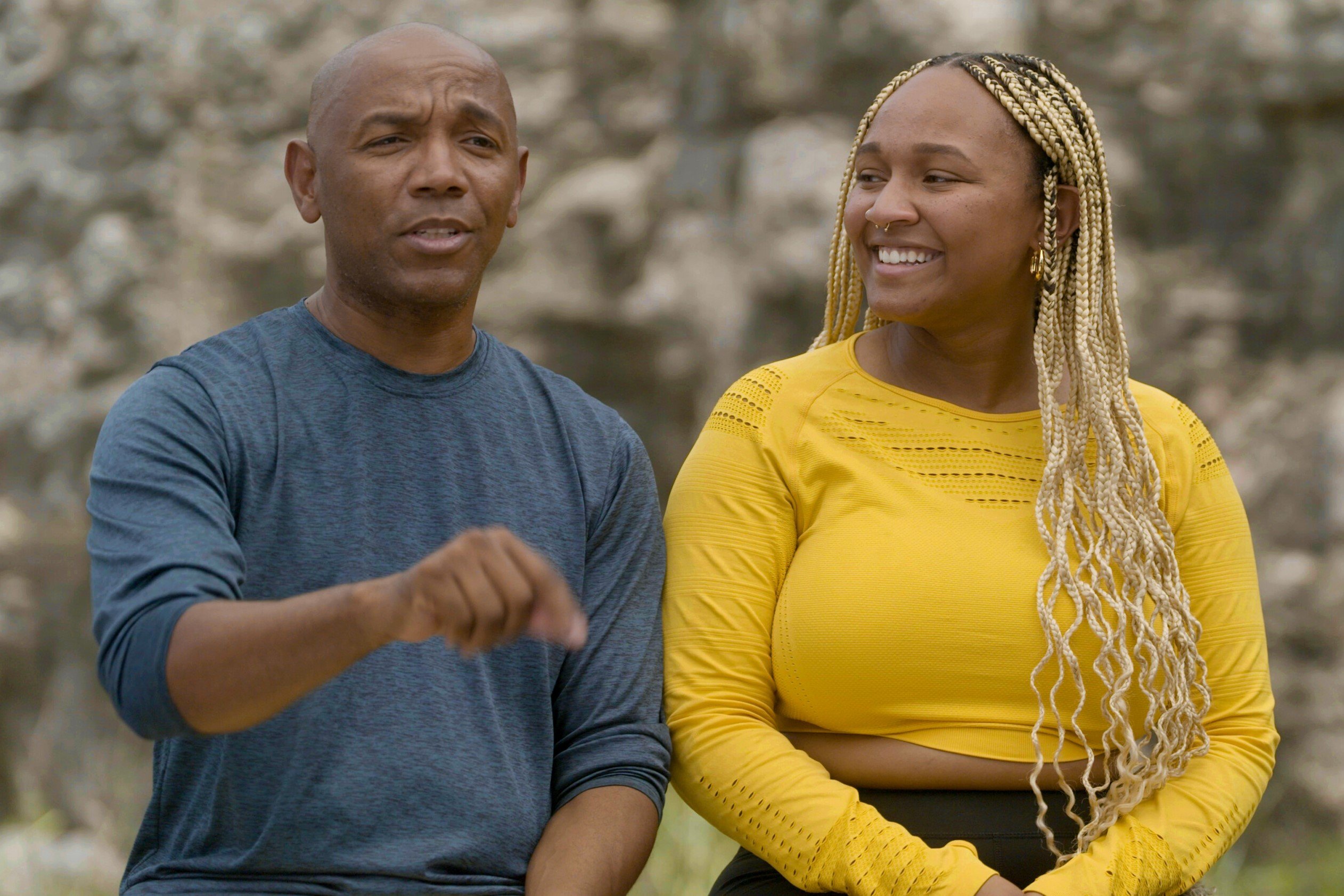 Linton Atkinson and Sharik Atkinson, who star in 'The Amazing Race' Season 34 on CBS, sit next to each other during a confessional.