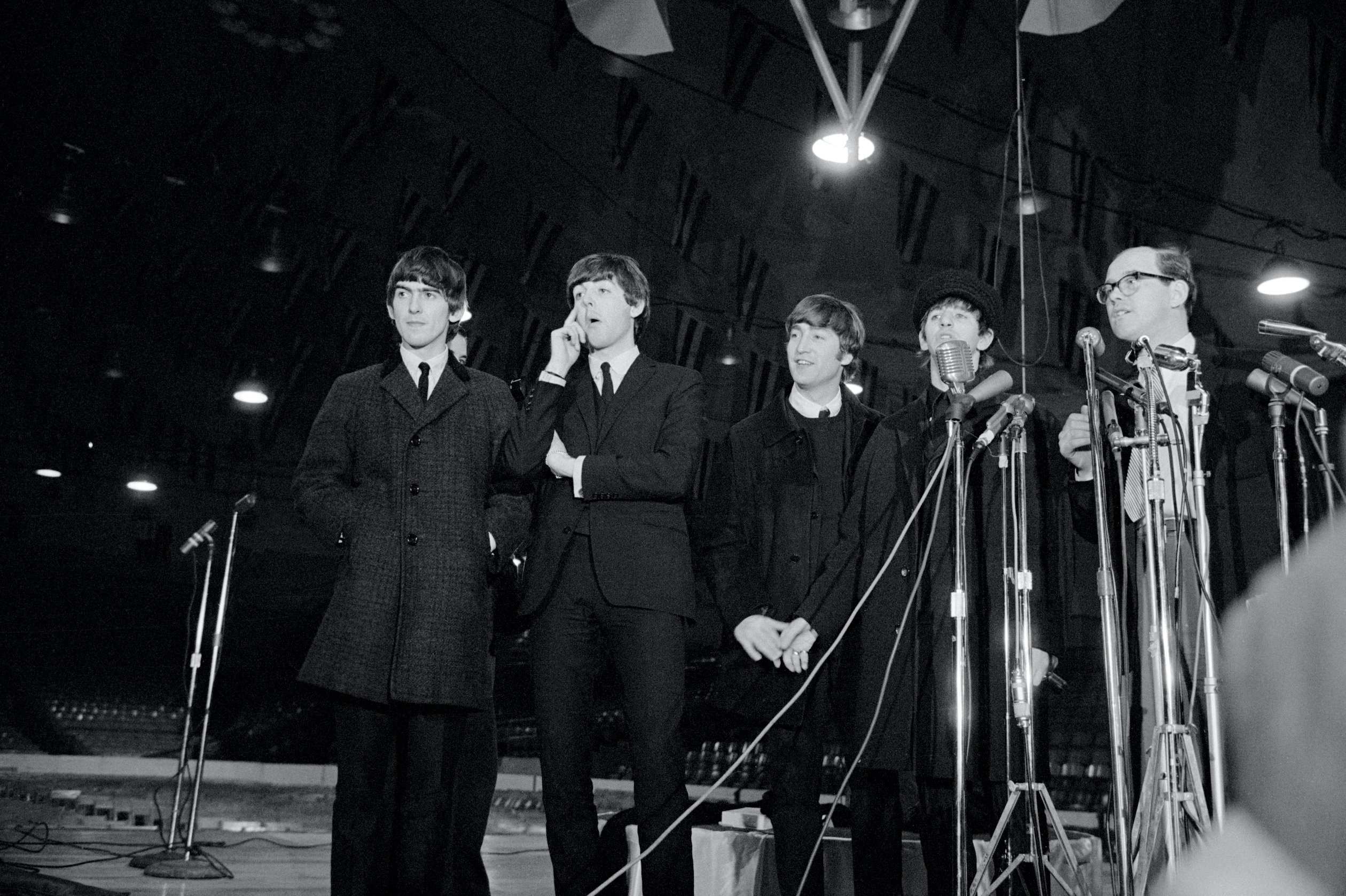 The Beatles attend a press conference in Washington, DC