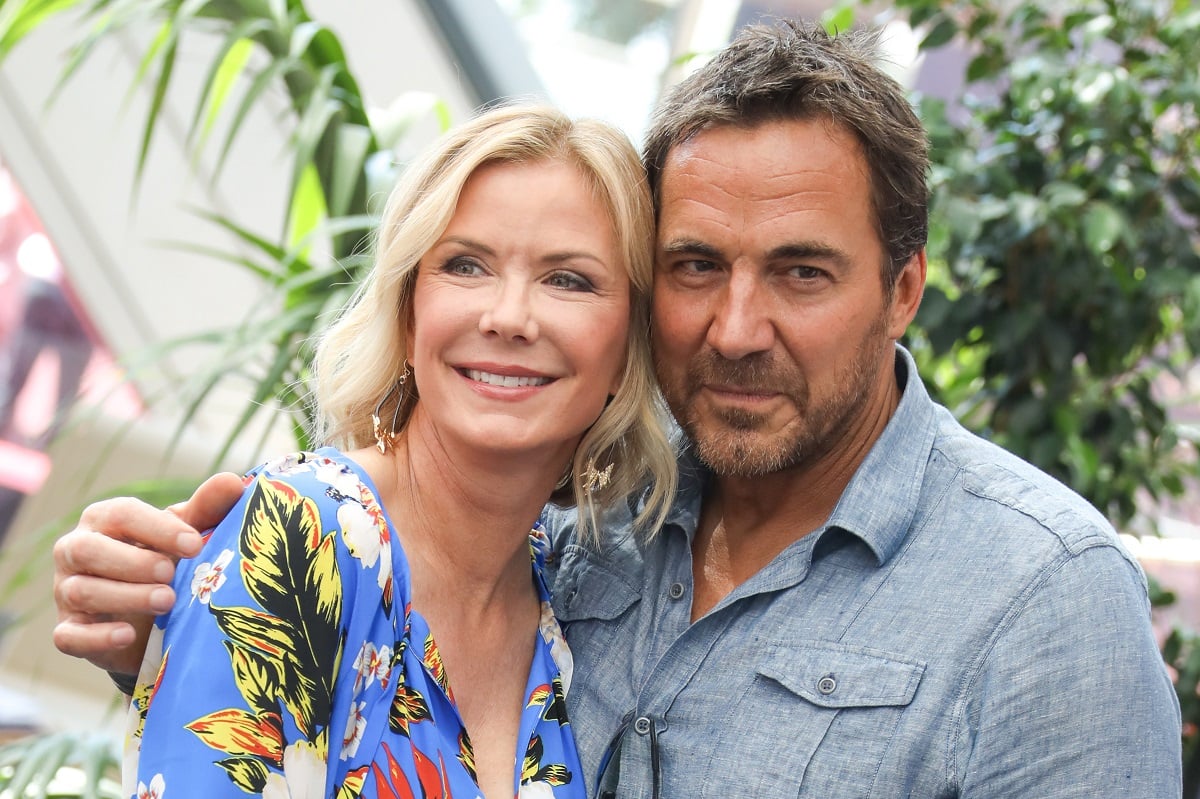 'The Bold and the Beautiful' star Katherine Kelly Lang in a blue floral dress and Thorsten Kaye in a blue shirt pose together.