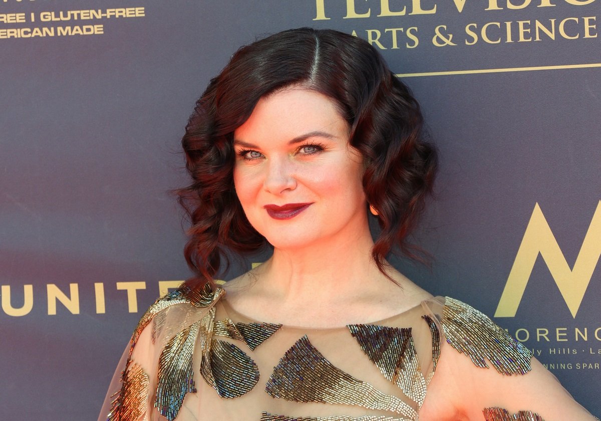 'The Bold and the Beautiful' star Heather Tom in a sheer gold dress, poses on the red carpet.