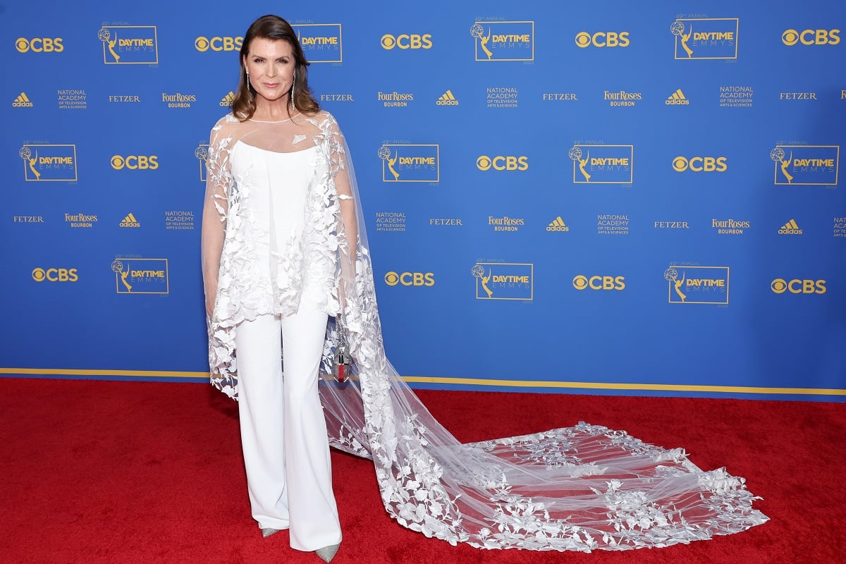 'The Bold and the Beautiful' star Kimberlin Brown dressed in white and posing on the red carpet of the 2022 Daytime Emmys.