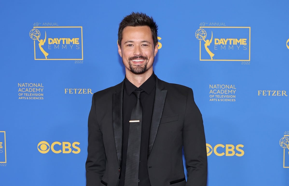 'The Bold and the Beautiful' star Matthew Atkinson wearing a black suit and smiling for a photo.