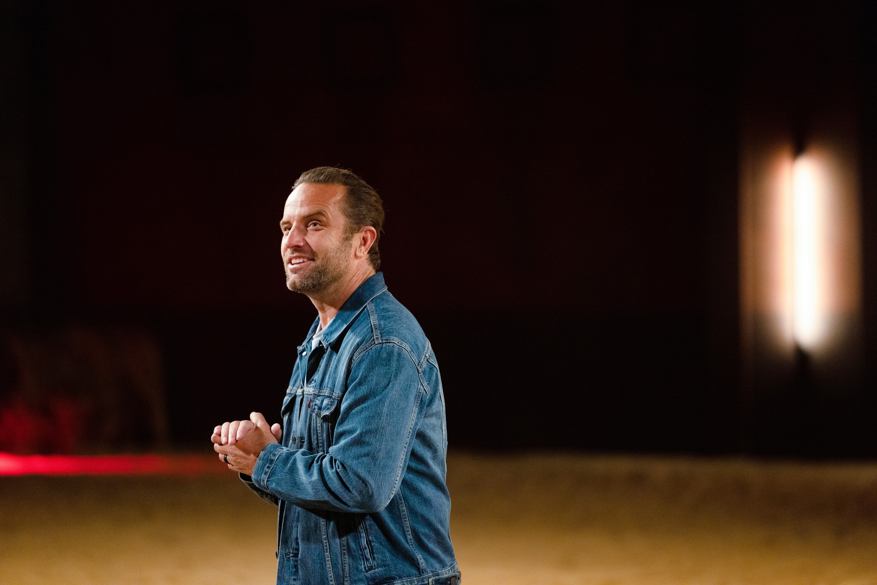 Host TJ Lavin standing during 'The Challenge'