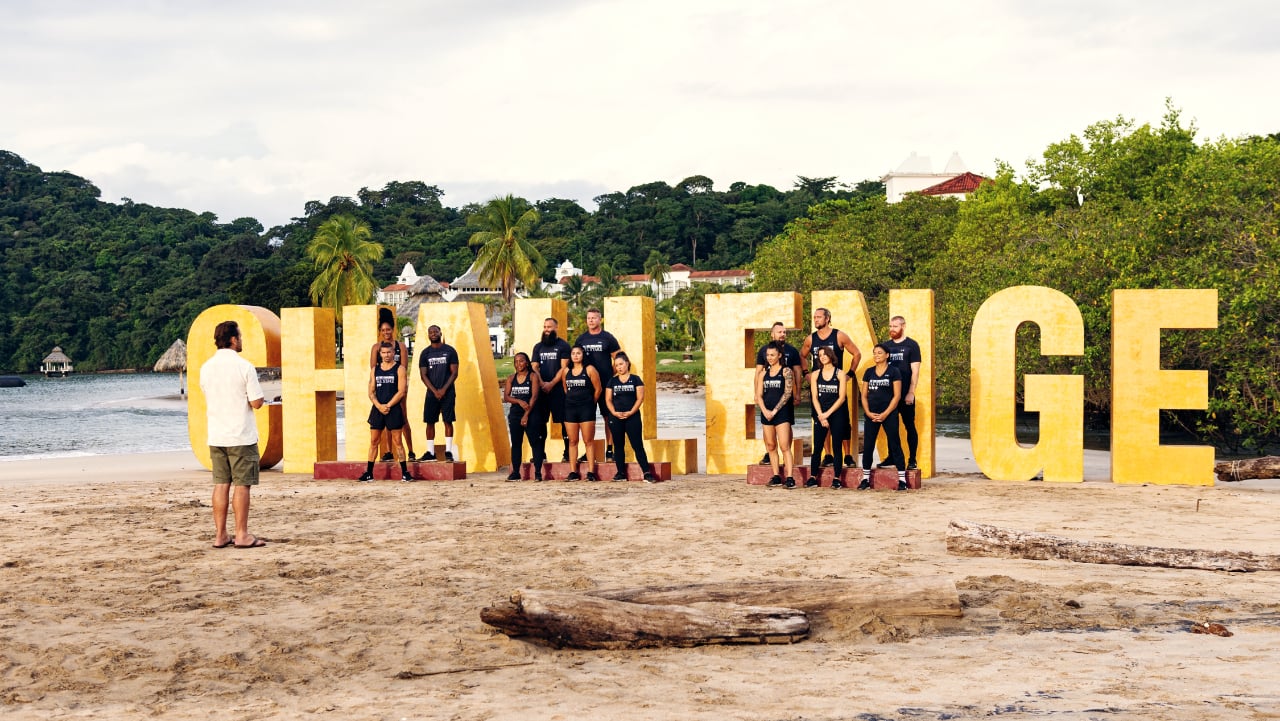 'The Challenge' cast standing in front of their logo