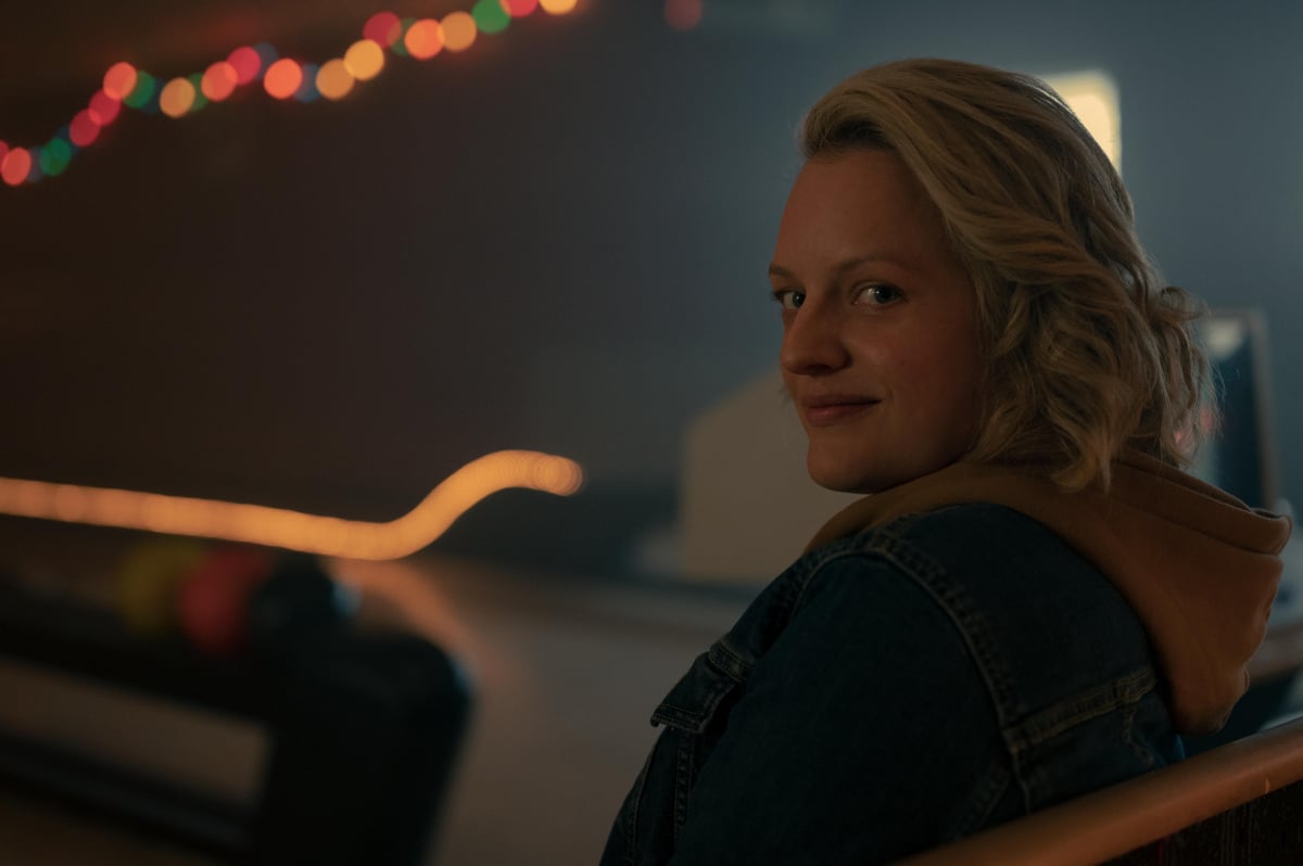 Owen Painter plays Jaden in The Handmaid's Tale Season 5. June smiles at the bowling alley.