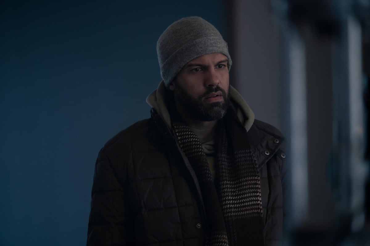 O-T Fagbenle as Luke in The Handmaid's Tale Season 5. Luke wears a beanie, scarf, and coat.