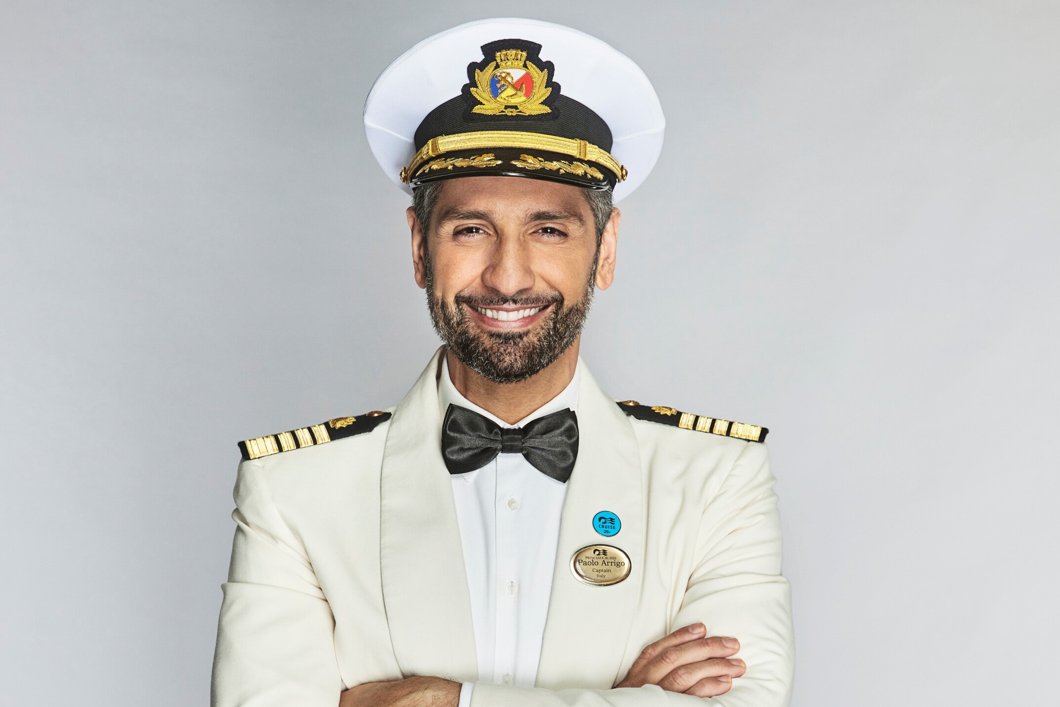 Captain Paolo Arrigo, who stars in 'The Real Love Boat' on CBS, wears his white, black, and gold captain uniform, including his captain hat.