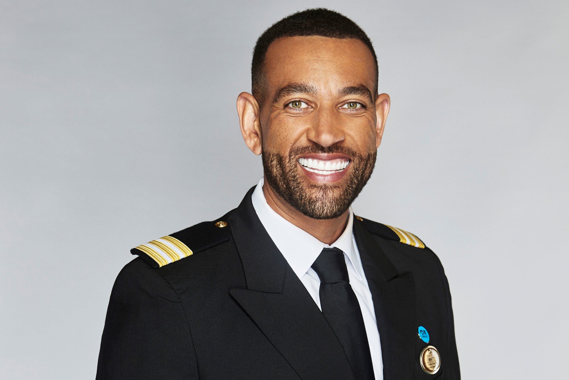 Matt Mitcham, who stars as the cruise director in 'The Real Love Boat' on CBS, wears his black and white suit uniform.
