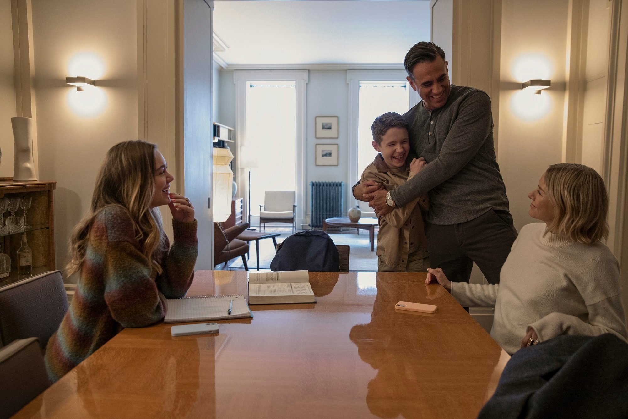 'The Watcher' fictional family: Isabel Marie Gravitt as Ellie Brannock, Luke David Blumm as Carter Brannock, Bobby Cannavale as Dean Brannock, and Naomi Watts as Nora Brannock around a table together